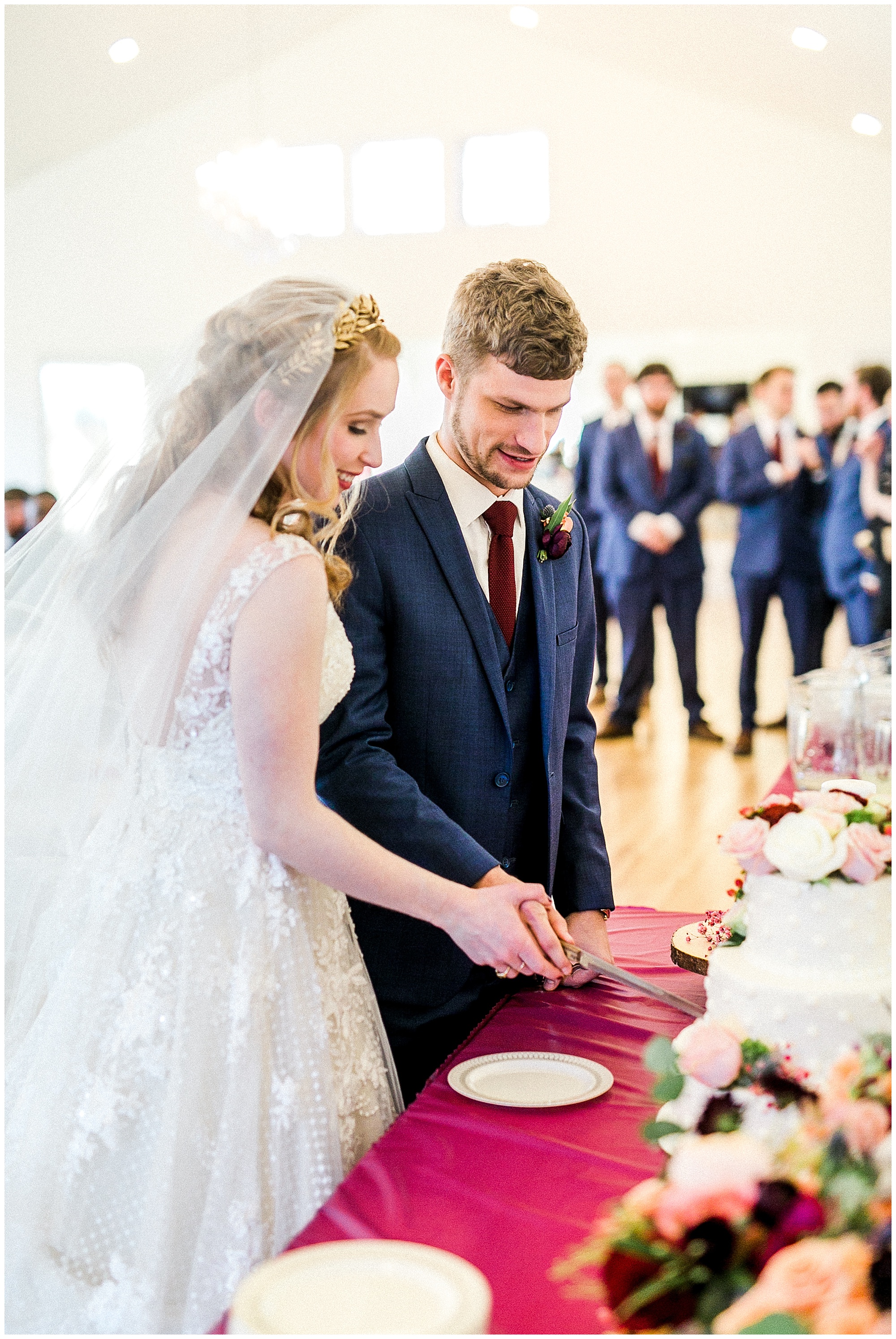 bride and groom cut wedding cake at Sky Retreat wedding reception
