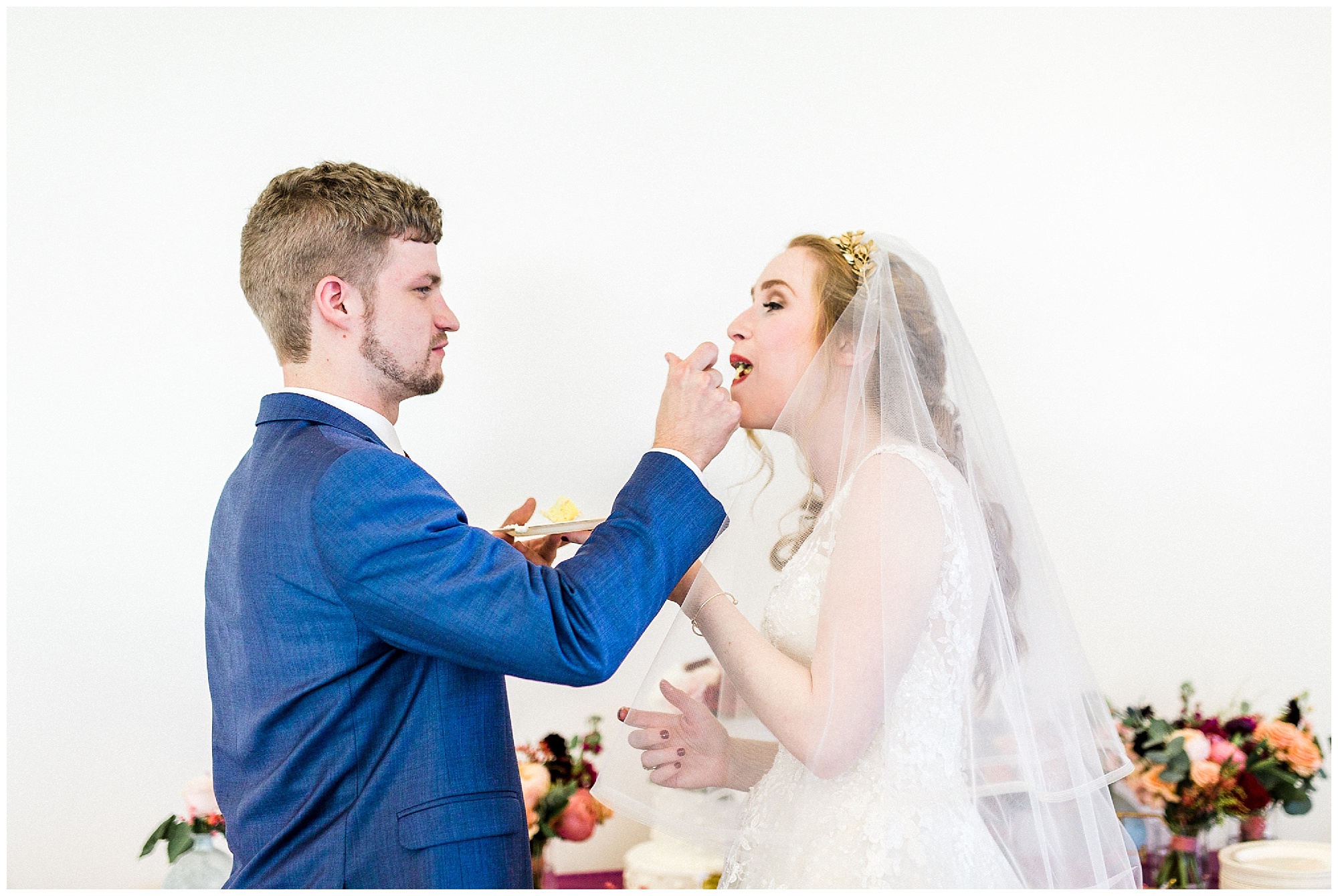 newlyweds eat wedding cake in North Carolina 