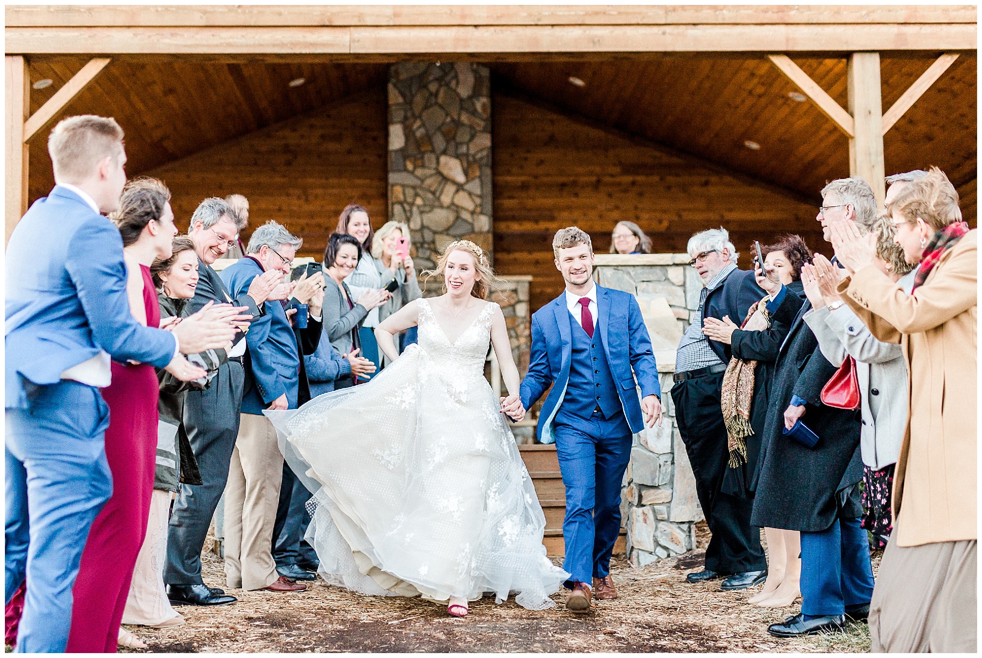 newlyweds leave Sky Retreat wedding reception with family clapping for them 