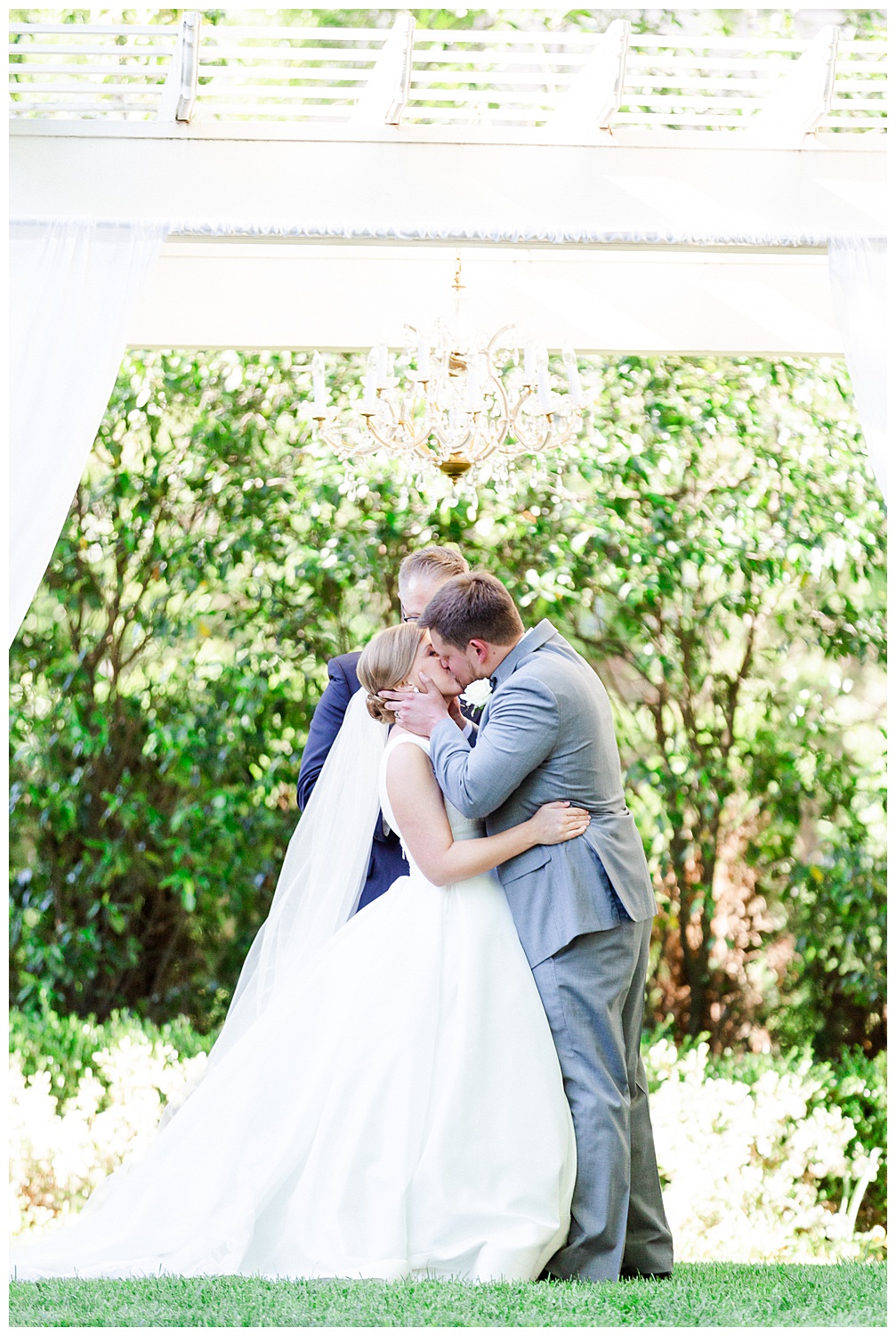 bride and groom kiss during a spring wedding at the separk mansion