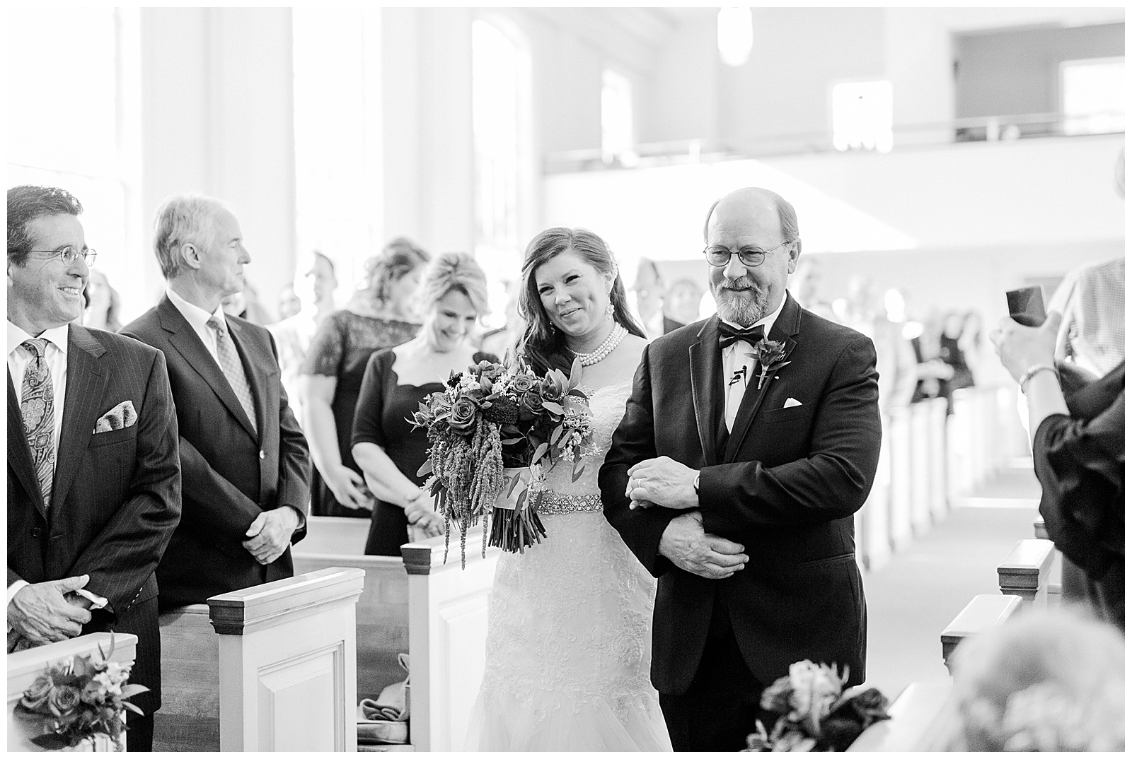 💍 emotional dad father of bride walks daughter down the aisle at wedding ceremony in indoor church 💍 Bright Colorful Summer City Wedding in Charlotte, NC with Taryn and Ryan | Kevyn Dixon Photography