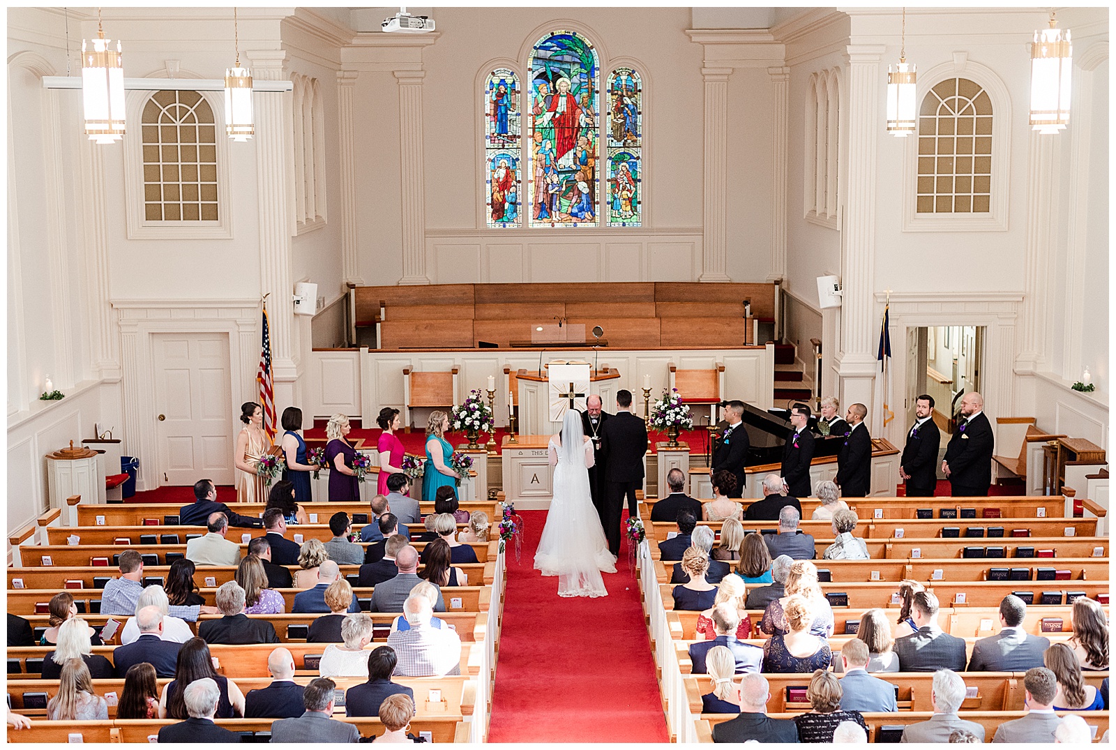 💍 wide shot of wedding ceremony in indoor church 💍 Bright Colorful Summer City Wedding in Charlotte, NC with Taryn and Ryan | Kevyn Dixon Photography