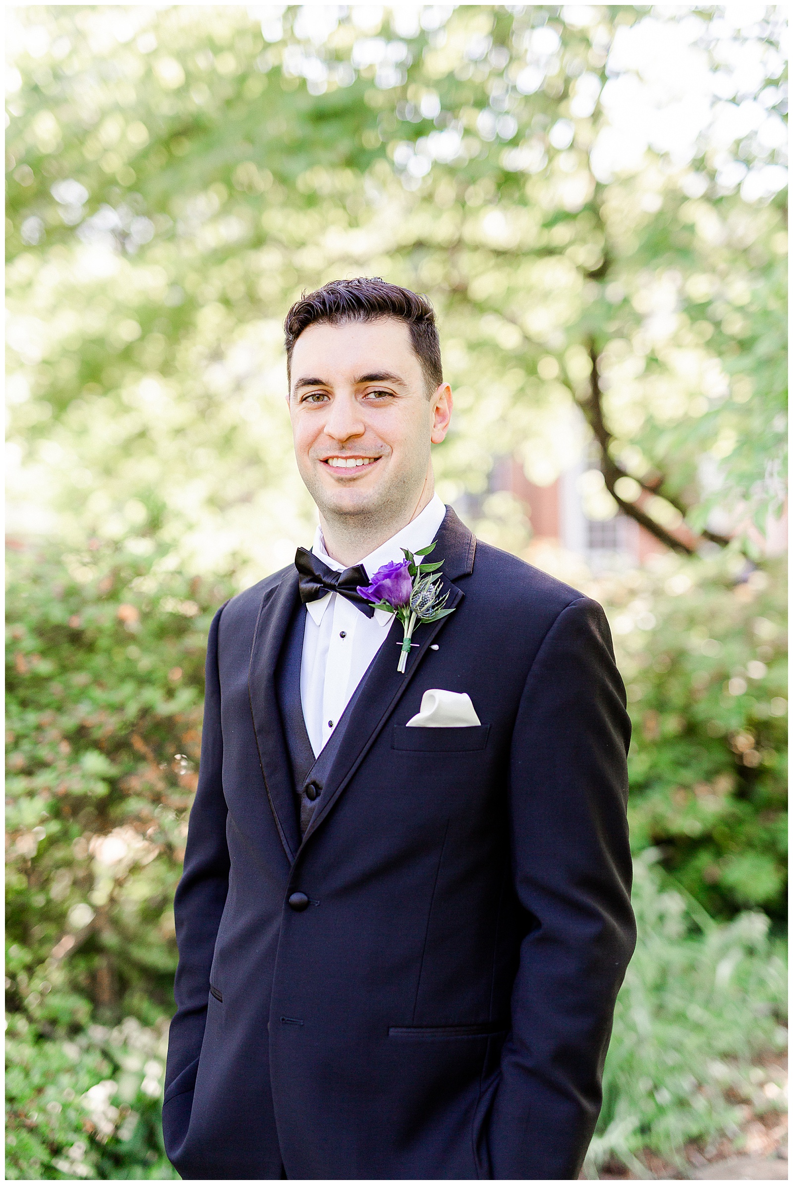 💍 groom getting ready portrait 🤵 Groom: black tux tuxedo and purple flower boutonnière 💍 Bright Colorful Summer City Wedding in Charlotte, NC with Taryn and Ryan | Kevyn Dixon Photography