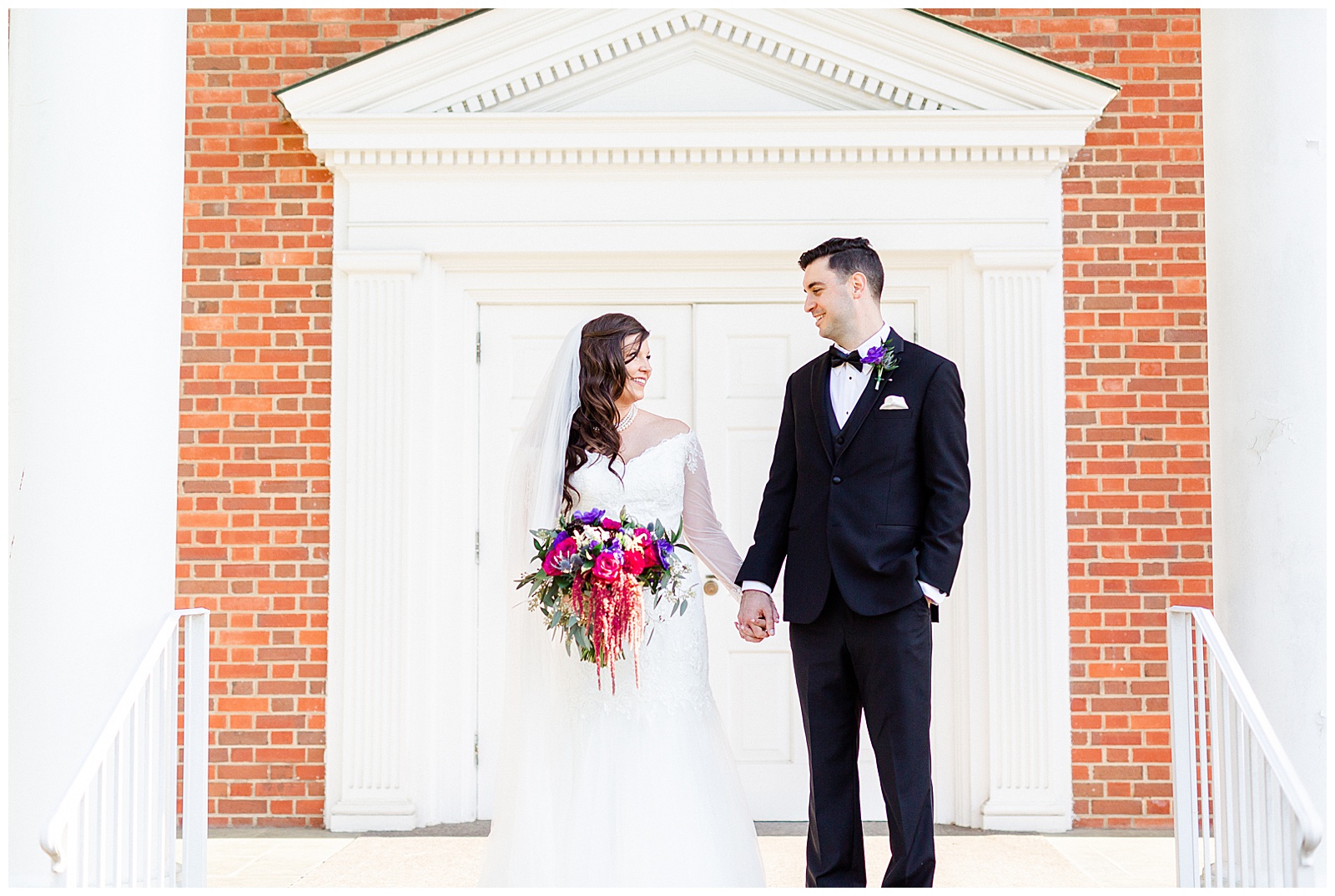 💍 bride groom outdoor portrait after church wedding 👰 Bride: lace wedding dress with rhinestone belt rhinestone barrette in hair down with pearls 🤵 Groom: black tux tuxedo and purple flower boutonnière 💍 Bright Colorful Summer City Wedding in Charlotte, NC with Taryn and Ryan | Kevyn Dixon Photography