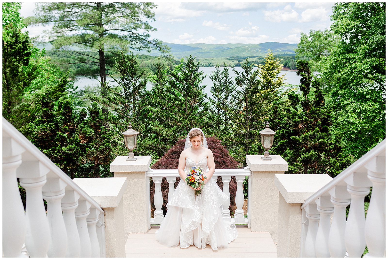 gorgeous scenic lakehouse white mansion location 👰 Bride: lace wedding dress + veil 💐 Colorful orange and blue bouquet 📸 Outdoorsy Lake and Mountain Bridal Session with Julia | Kevyn Dixon Photography