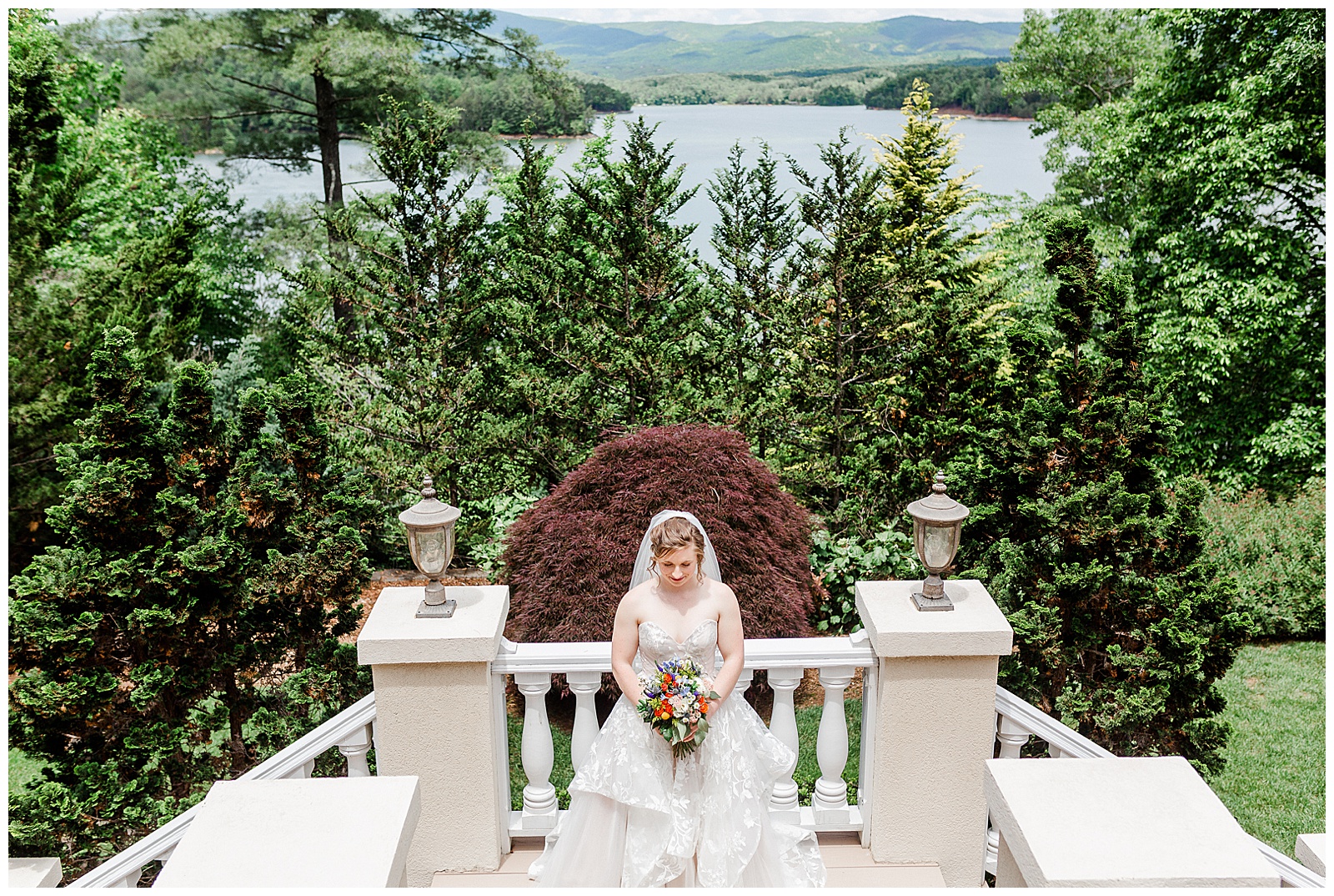 gorgeous scenic lakehouse white mansion location 👰 Bride: lace wedding dress + veil 💐 Colorful orange and blue bouquet 📸 Outdoorsy Lake and Mountain Bridal Session with Julia | Kevyn Dixon Photography