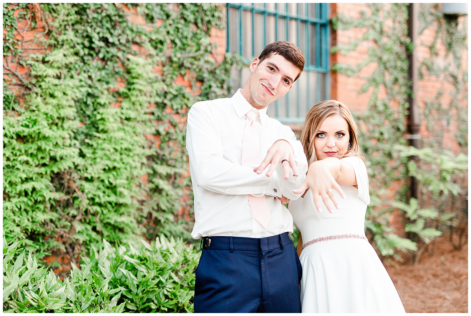 Funny Bride and Groom Photo of Rings outdoor portraits in front of vine-covered brick building from Summer Wedding in Charlotte, NC | Check out the full wedding at KevynDixonPhoto.com