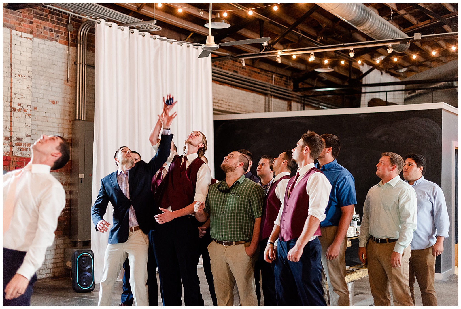 Funny groomsmen catch the garter from Summer Wedding in Charlotte, NC | Check out the full wedding at KevynDixonPhoto.com