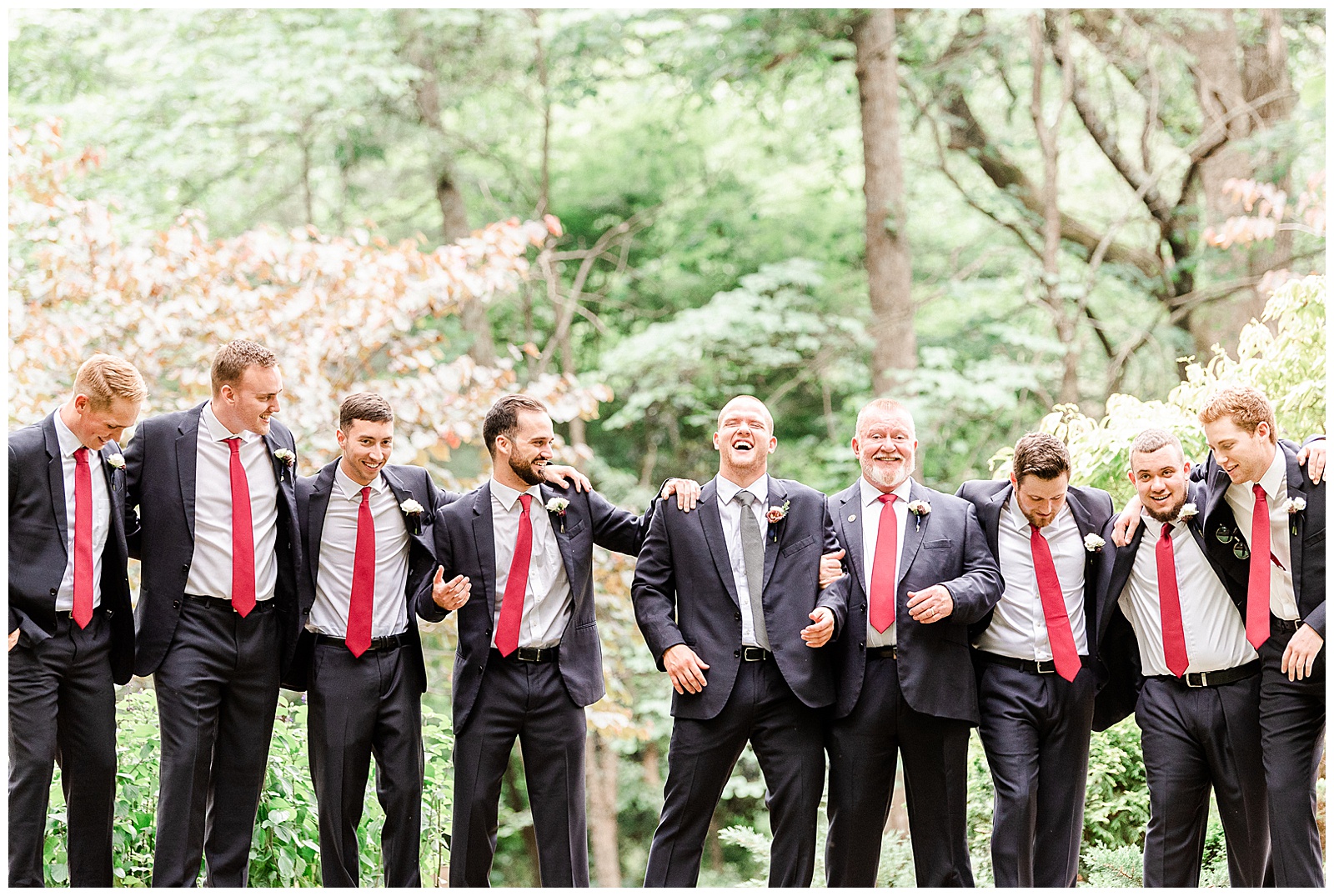 Dapper groomsmen in dark gray-blue suits from Elegant Modern Red and Navy Blue Themed Wedding in Charlotte, NC | check out the full wedding at KevynDixonPhoto.com
