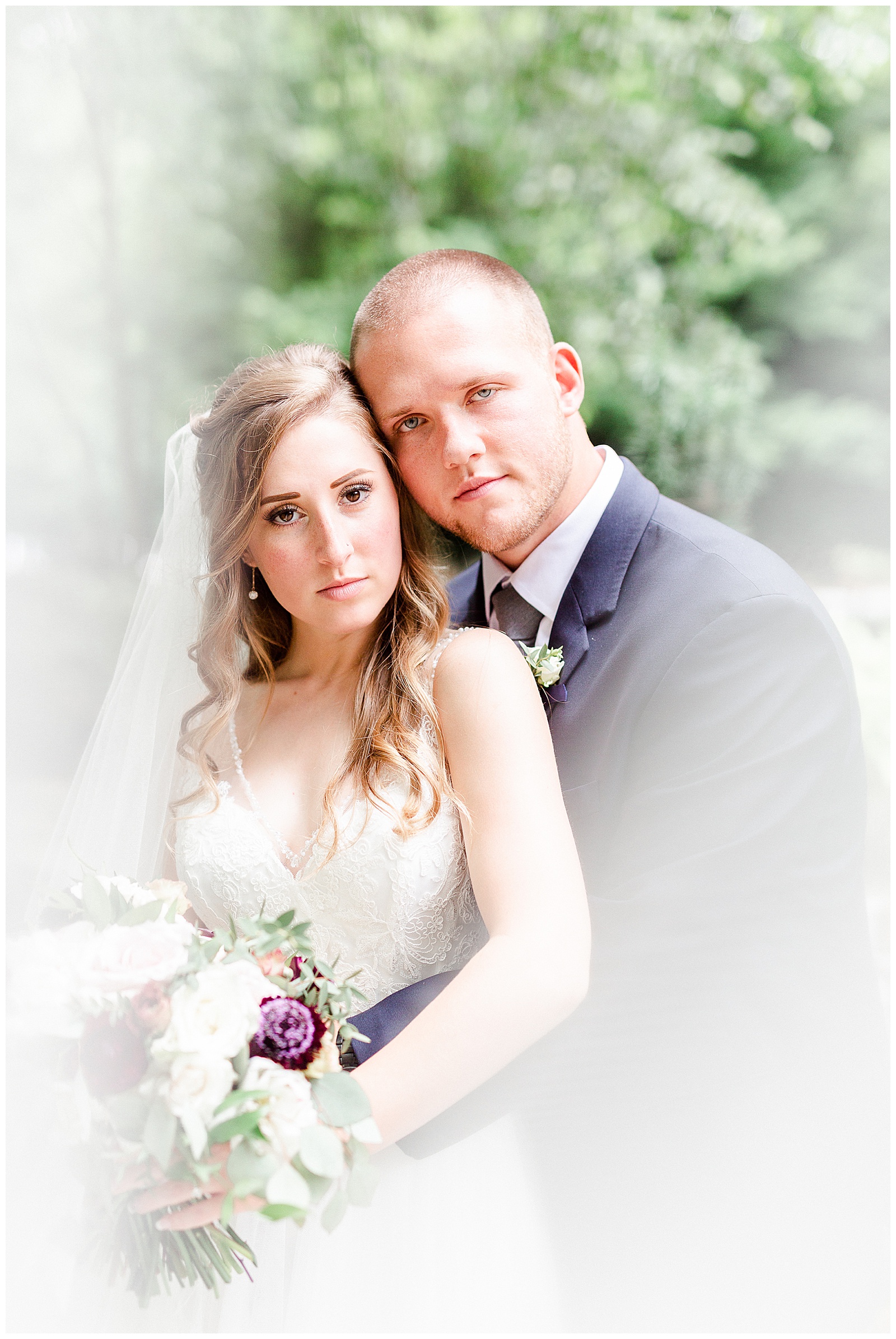 Stunning Serious Model Photos of Gorgeous Bride in Simple V-Neck Lace wedding dress and dapper groom in gray-blue suit from Elegant Modern Summer Wedding in Charlotte, NC | check out the full wedding at KevynDixonPhoto.com