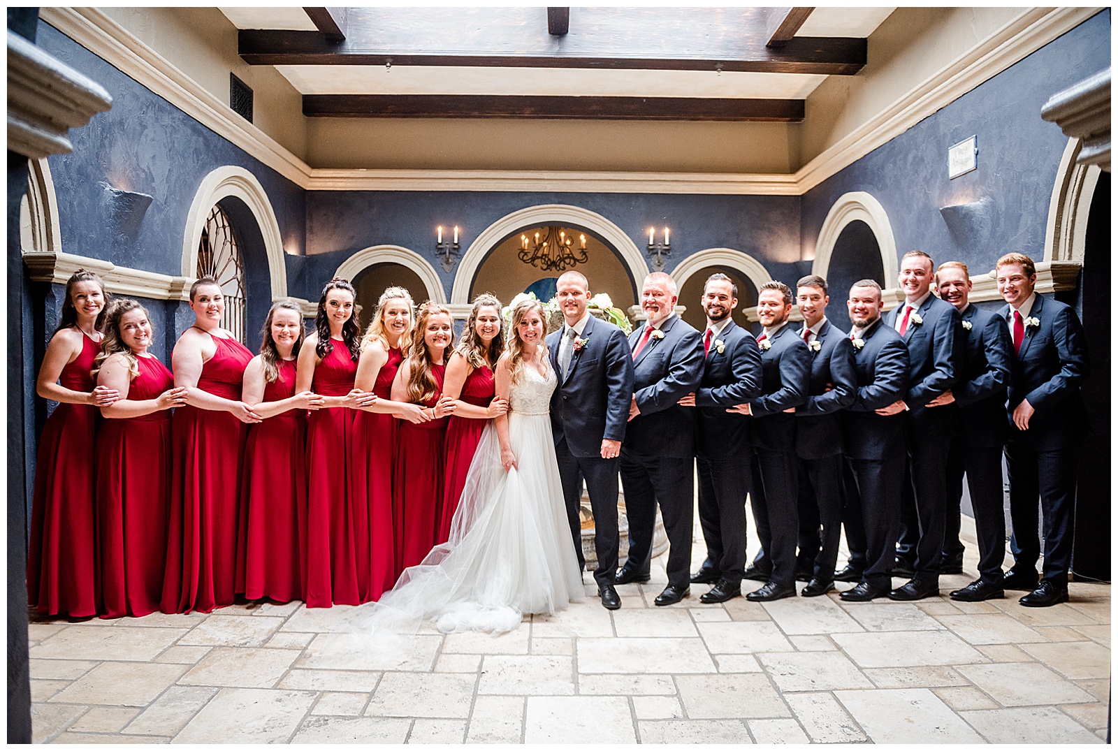 Stunning Navy Blue Groomsmen and Red Themed Bridesmaid Dresses Group Photo from Elegant Modern Summer Wedding in Charlotte, NC | check out the full wedding at KevynDixonPhoto.com