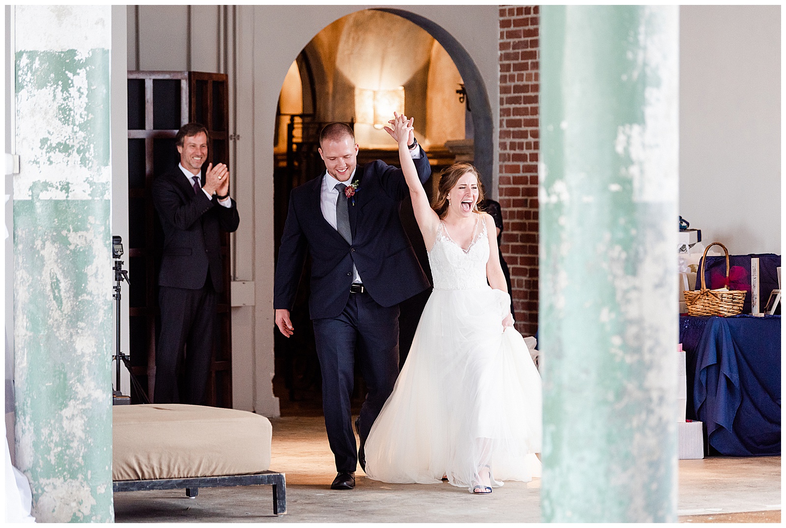 Bride and Groom Arrive at Rustic Airy Indoor Wedding Venue from Navy Blue and Gold-Themed Elegant Modern Summer Wedding in Charlotte, NC | check out the full wedding at KevynDixonPhoto.com