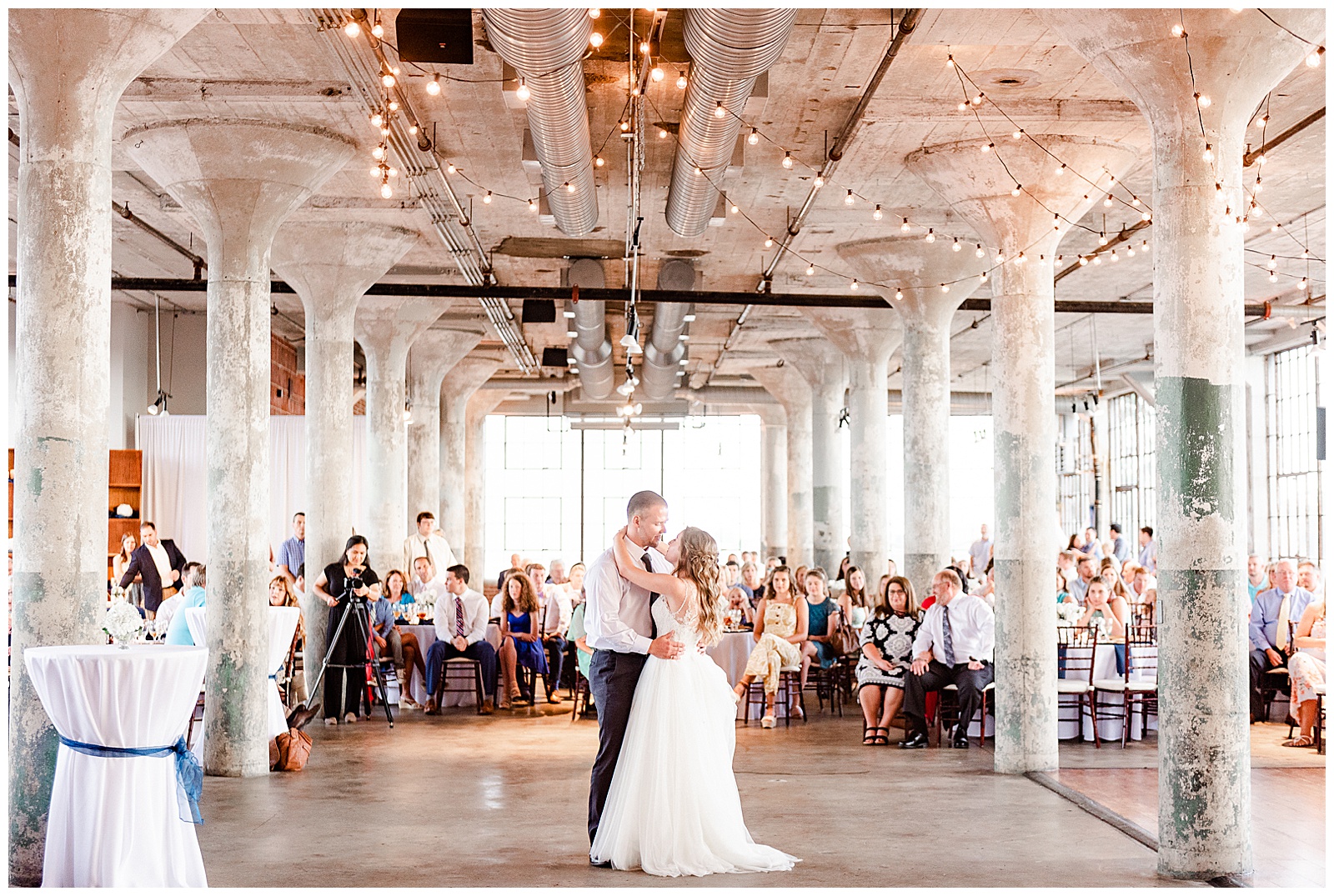 Bride and Groom First Dance at Rustic Airy Indoor Wedding Venue with fairy lights in Elegant Modern Summer Wedding in Charlotte, NC | check out the full wedding at KevynDixonPhoto.com