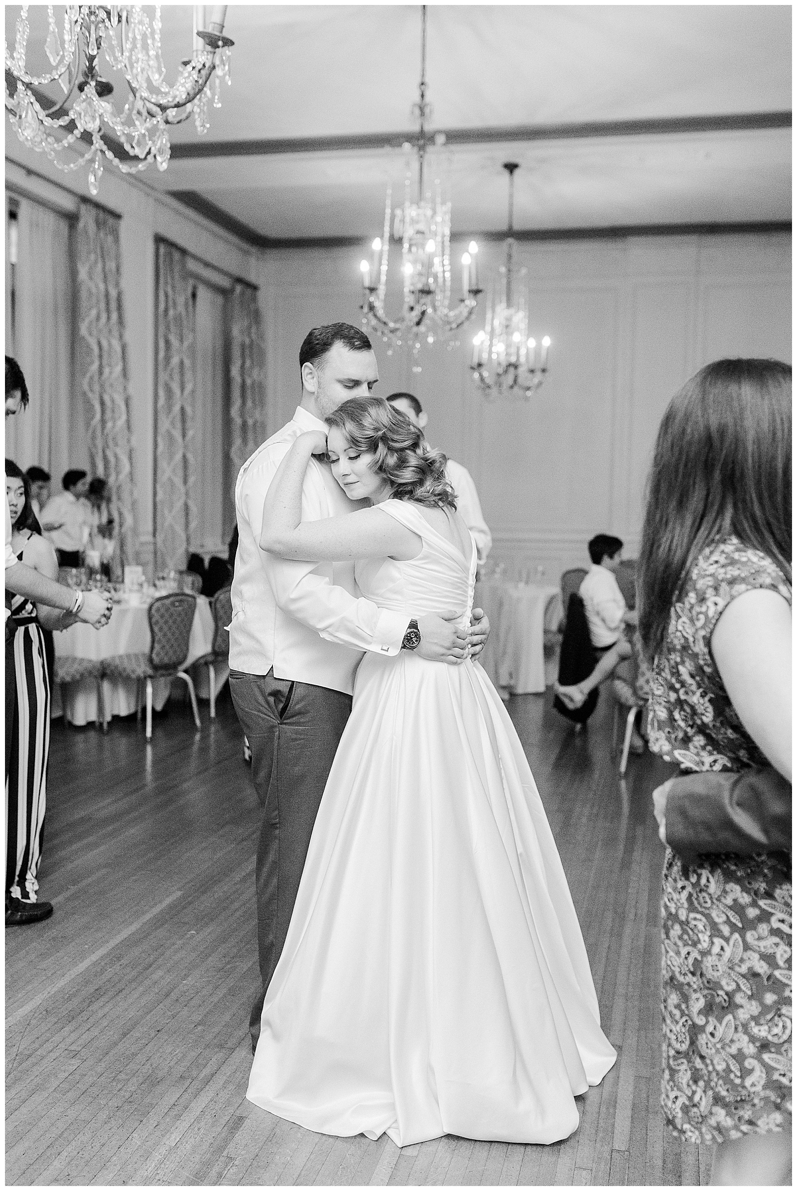 Bride and Groom share a special moment at elegant indoor floral venue in 1940s Modern Vintage Wedding in Charlotte, NC | check out the full wedding at KevynDixonPhoto.com