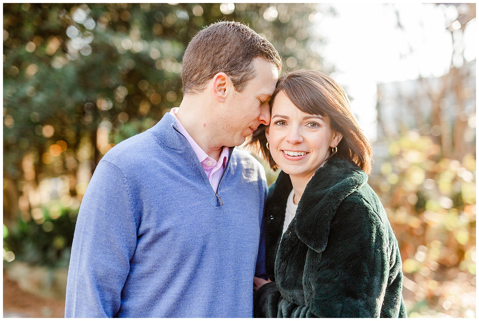 Sweet Couple in Park at Outdoor Winter Golden Hour Engagement Session in NC - green fuzzy coat, short brown hair bride outfit ideas
