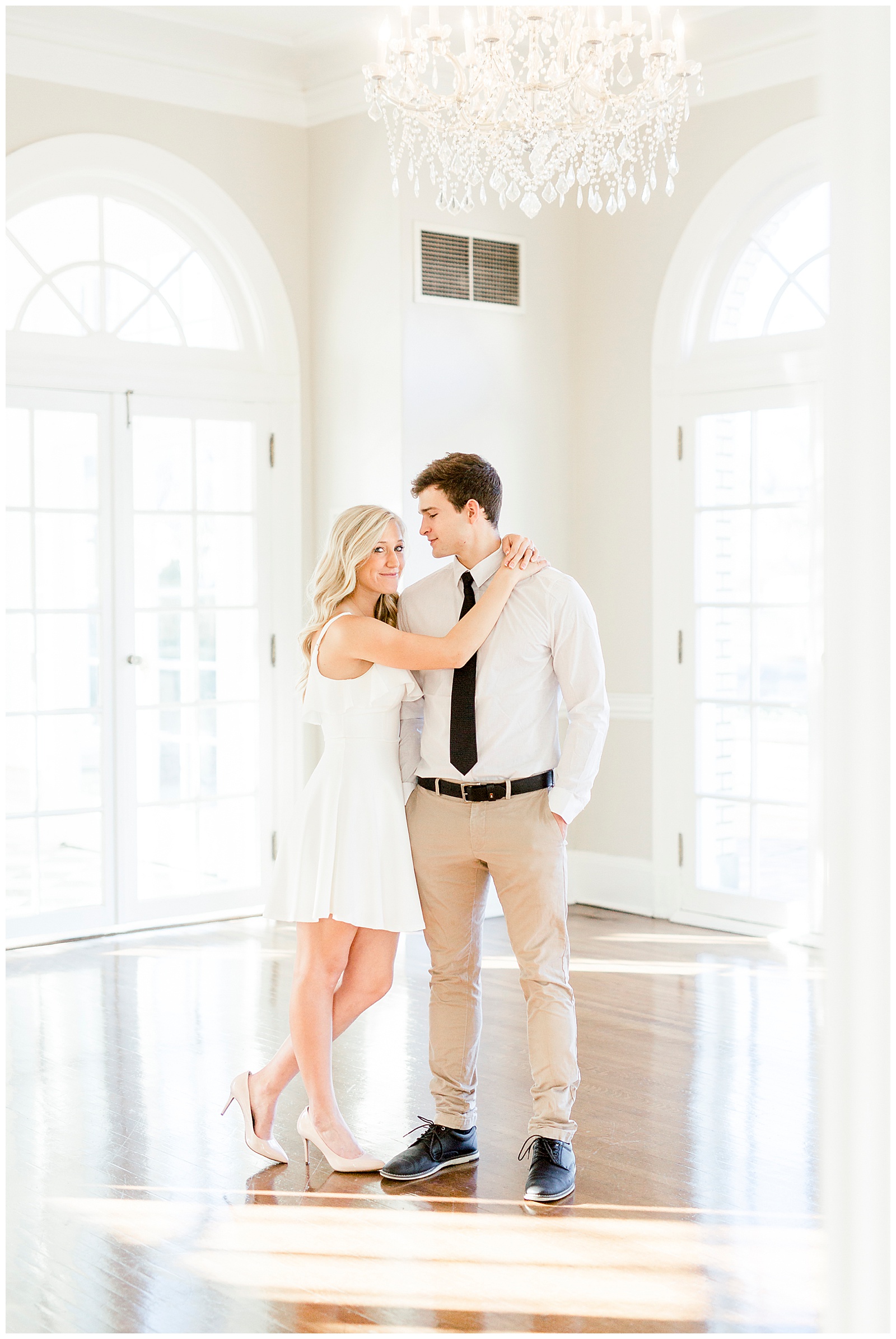 Adorable Couple Posing in Gorgeous Light and Airy Separk Mansion Engagement Session - classy black and white dress outfit ideas