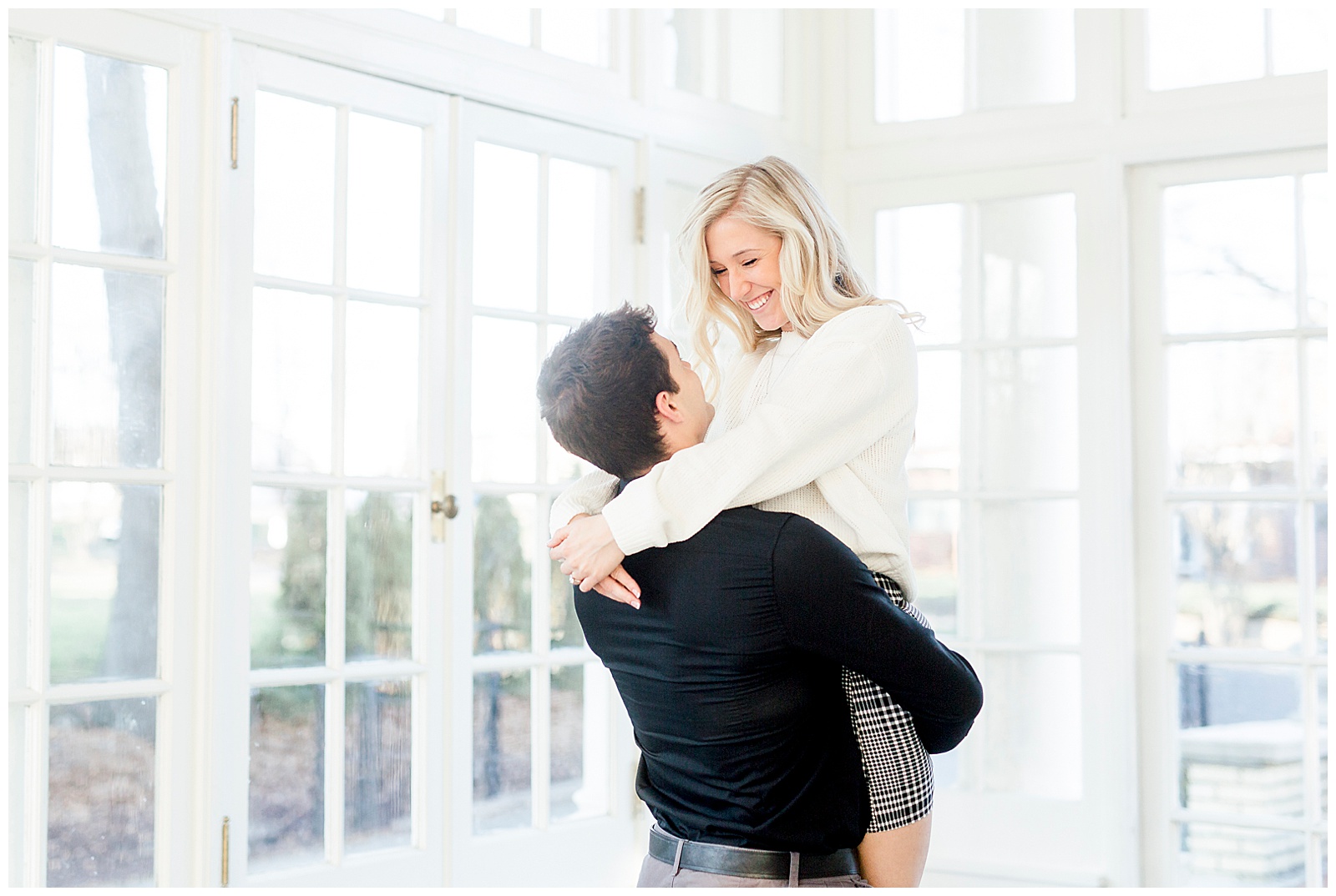Adorable Couple Posing in Gorgeous Light and Airy Separk Mansion Engagement Session - classy cute white sweater pencil skirt and tall black boots outfit ideas