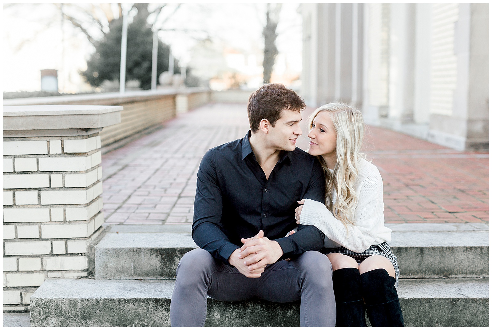 Adorable Couple Posing Outdoors in Gorgeous Light and Airy Separk Mansion Winter Engagement Session - classy cute white sweater pencil skirt and tall black boots outfit ideas