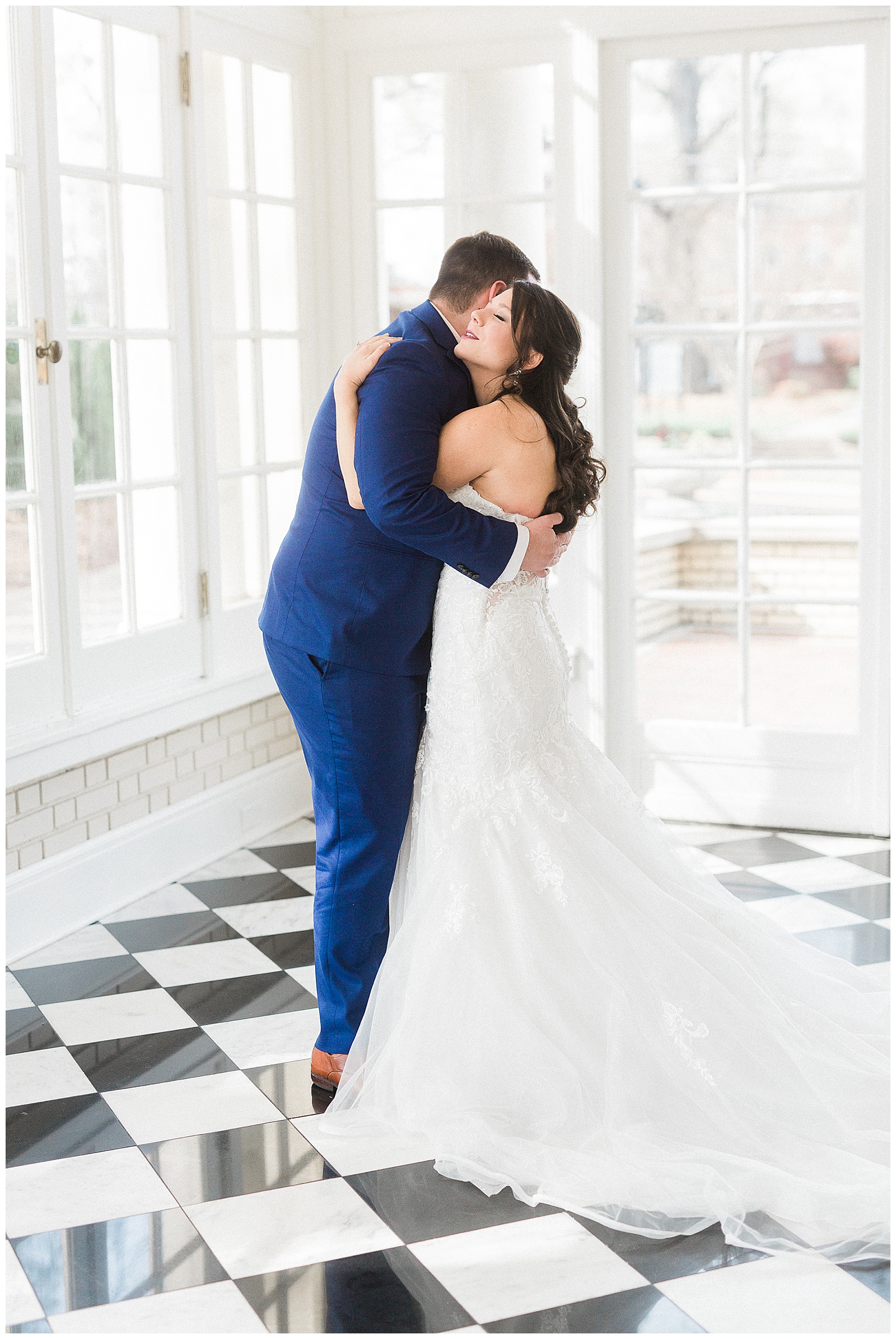 Groom Hugs Bride from Light and Airy Outdoor Wedding at Separk Mansion in Gastonia, NC | Kevyn Dixon Photography