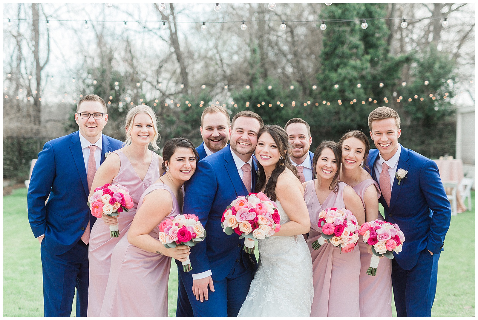 Soft Pink Navy Blue Color Theme Bridesmaid Bride Tribe and Groomsmen Group Photo from Light and Airy Outdoor Wedding at Separk Mansion in Gastonia, NC | Kevyn Dixon Photography