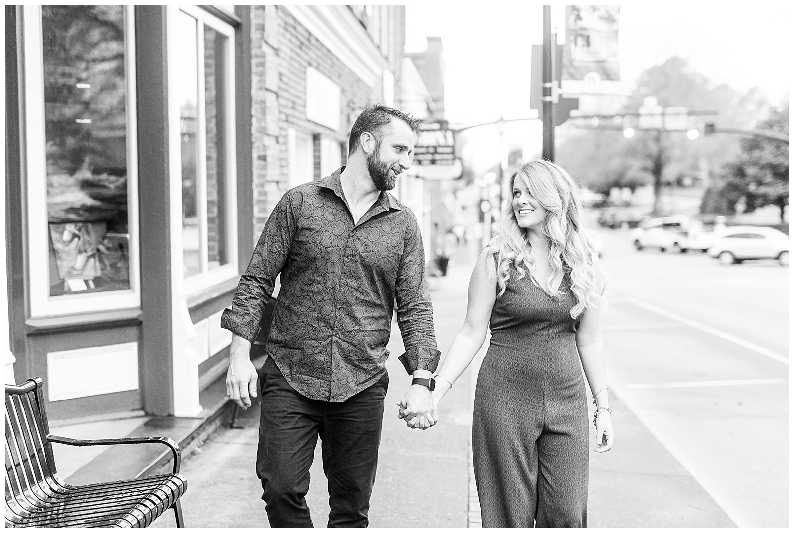 Adorable couple walking down the street in downtown Waxhaw, NC Engagement Session with Green Dress Outfit Ideas