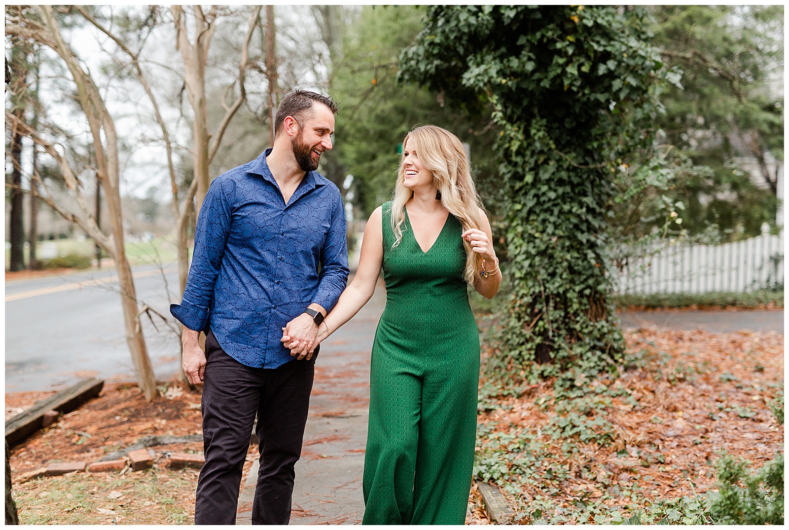 Adorable couple walking through park in downtown Waxhaw, NC Engagement Session with Green Dress Outfit Ideas