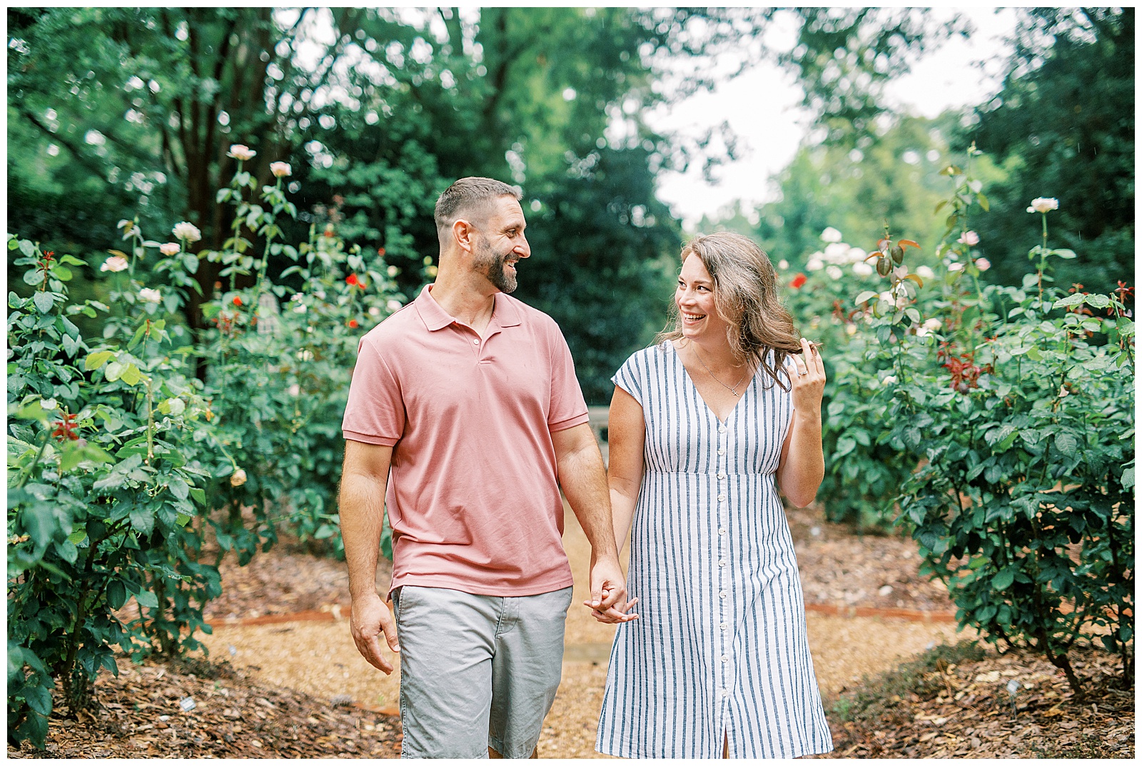 Couple Engagement Session in Gardens at Duke Mansion Garden with Blue Pinstripe Summer Dress