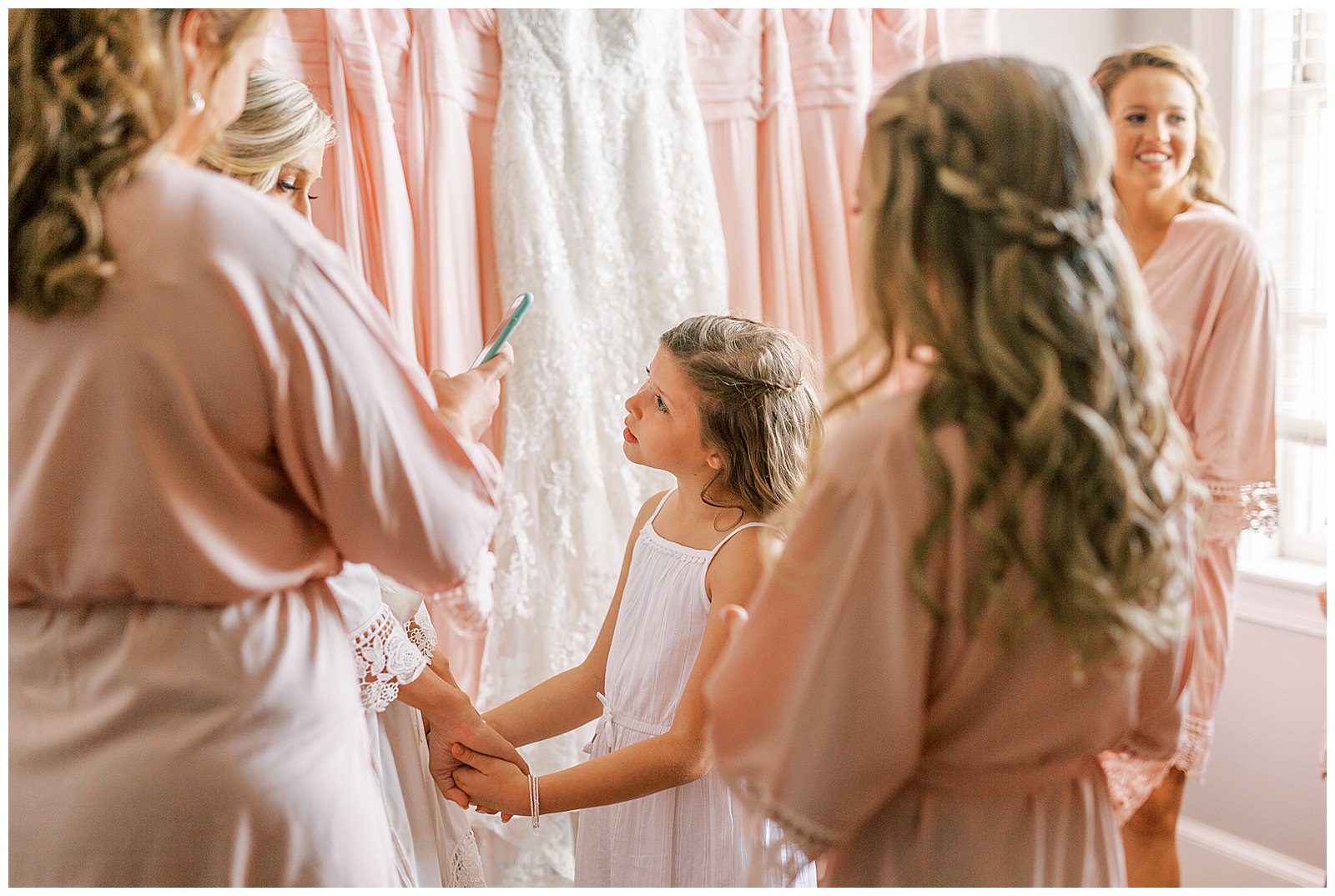flower girl with blush pink bridesmaid dresses color palette