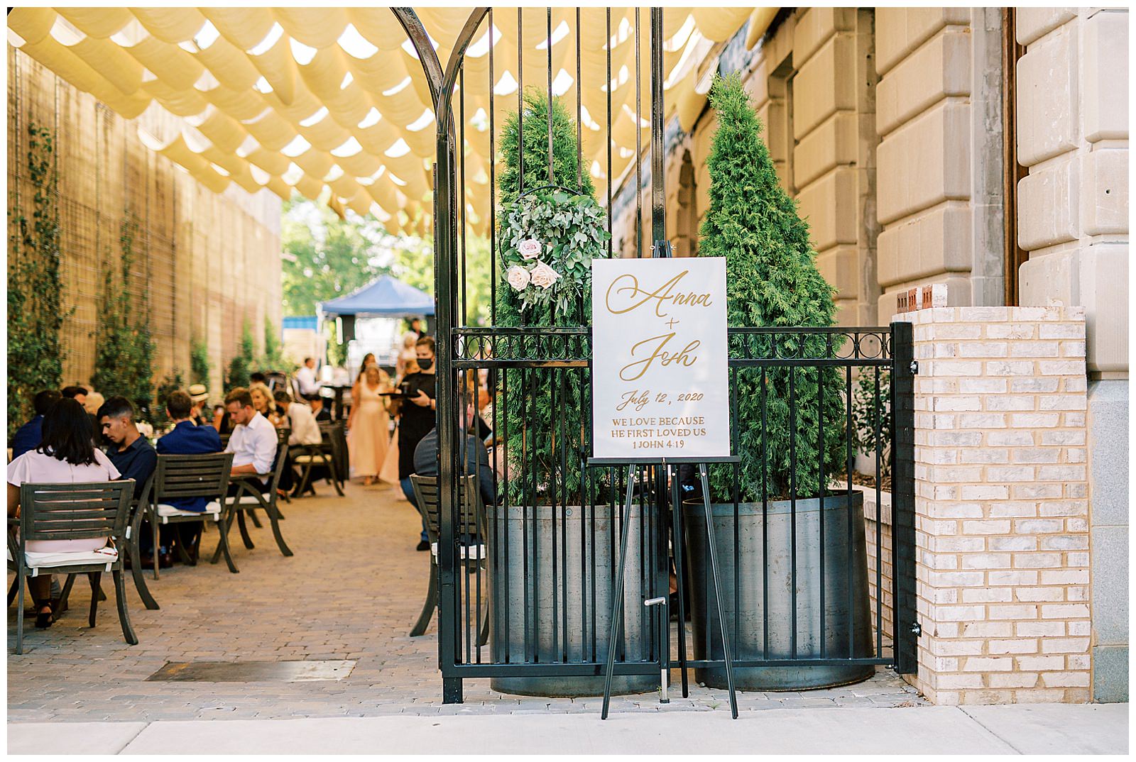 esquire hotel outdoor patio wedding reception with gold lettered wedding sign