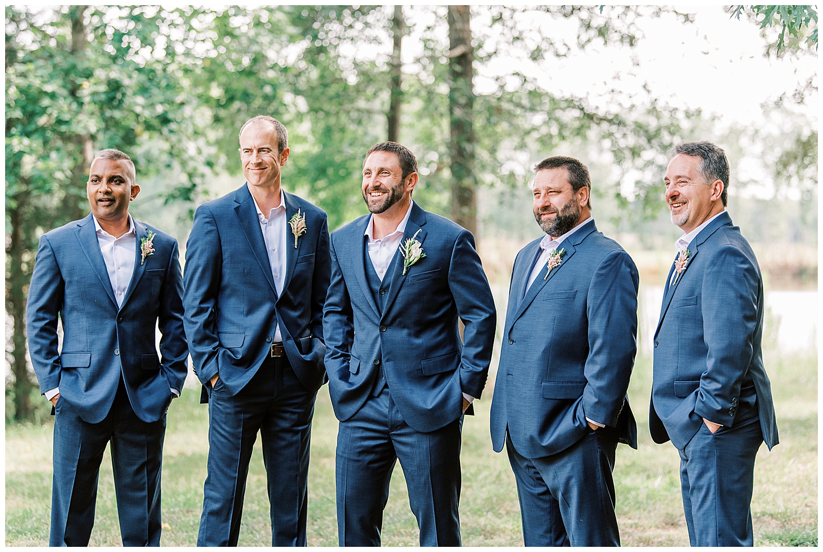 groomsmen group portrait in navy blue suits