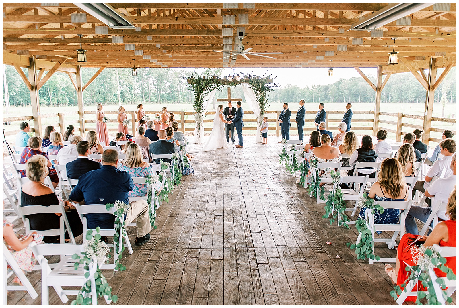 wide open indoor outdoor summer wedding ceremony