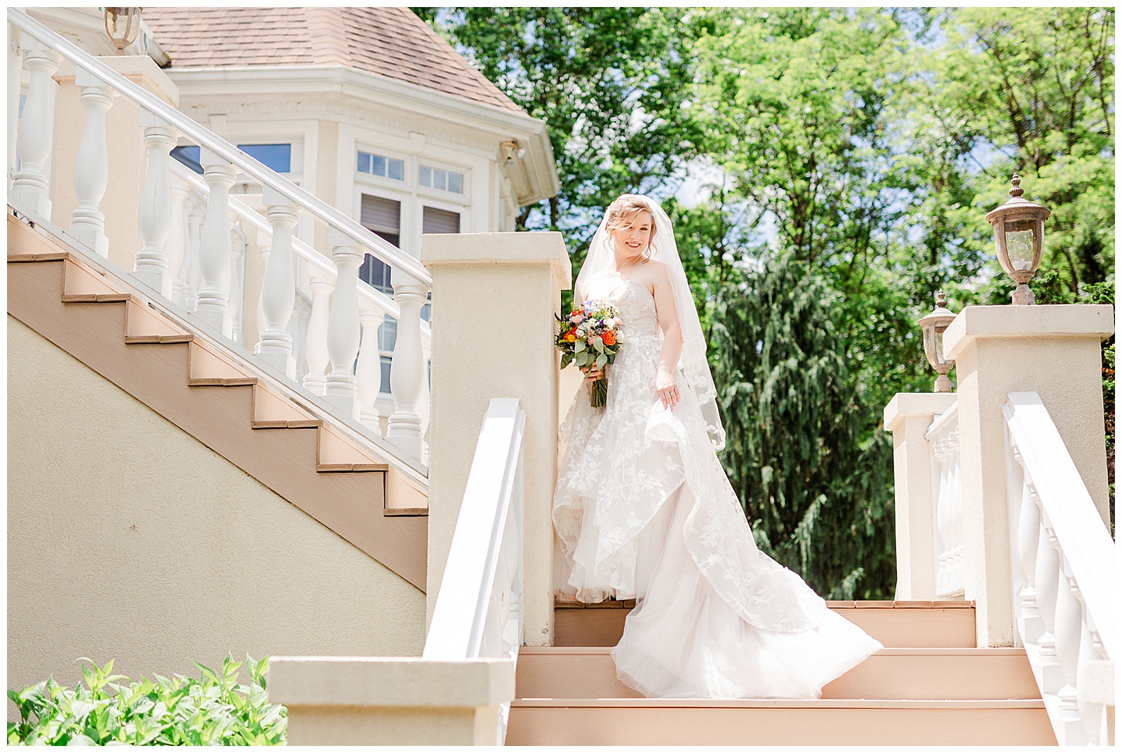 gorgeous scenic lakehouse white mansion location 👰 Bride: lace wedding dress + veil 💐 Colorful orange and blue bouquet 📸 Outdoorsy Lake and Mountain Bridal Session with Julia | Kevyn Dixon Photography