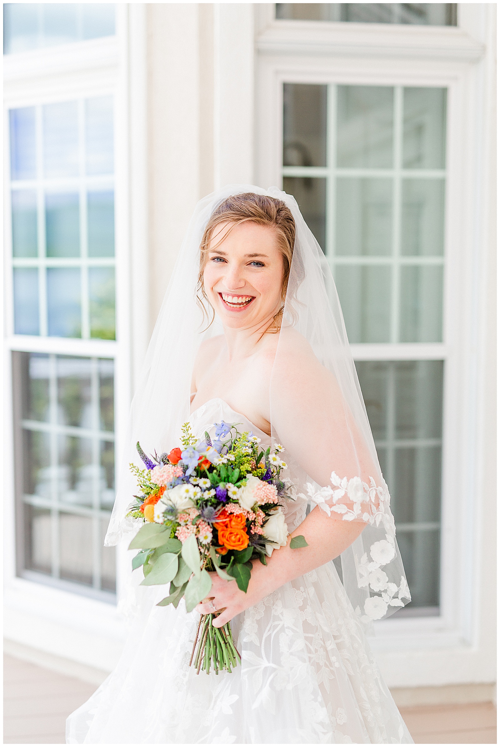 lakehouse white mansion location π° Bride: lace wedding dress + veil π Colorful orange and blue bouquet πΈ Outdoorsy Lake and Mountain Bridal Session with Julia | Kevyn Dixon Photography