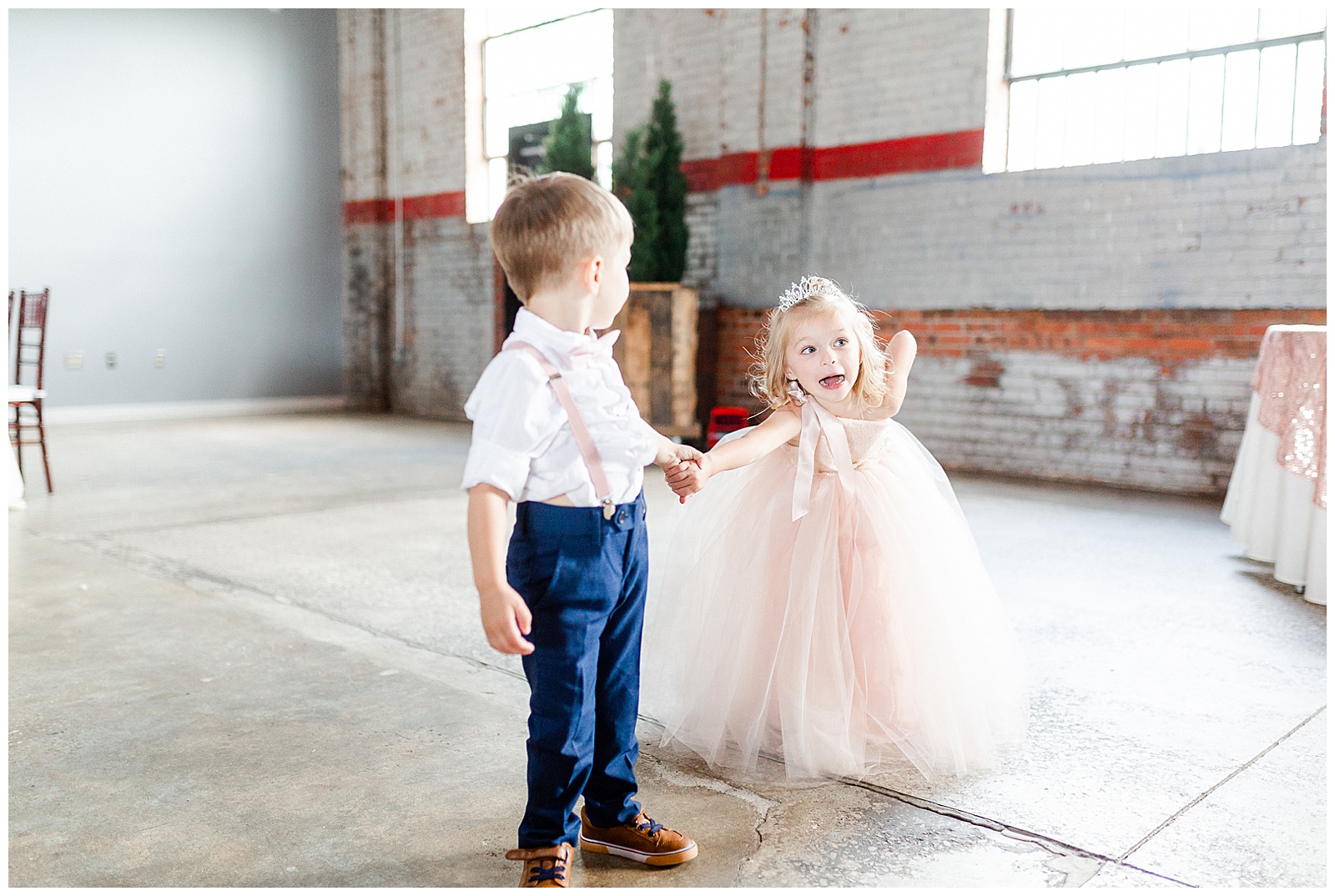 Adorable Flower Girl and Ring Boy Photos in Fluffy Pink Dress and Suspenders from Summer Wedding in Charlotte, NC | Check out the full wedding at KevynDixonPhoto.com