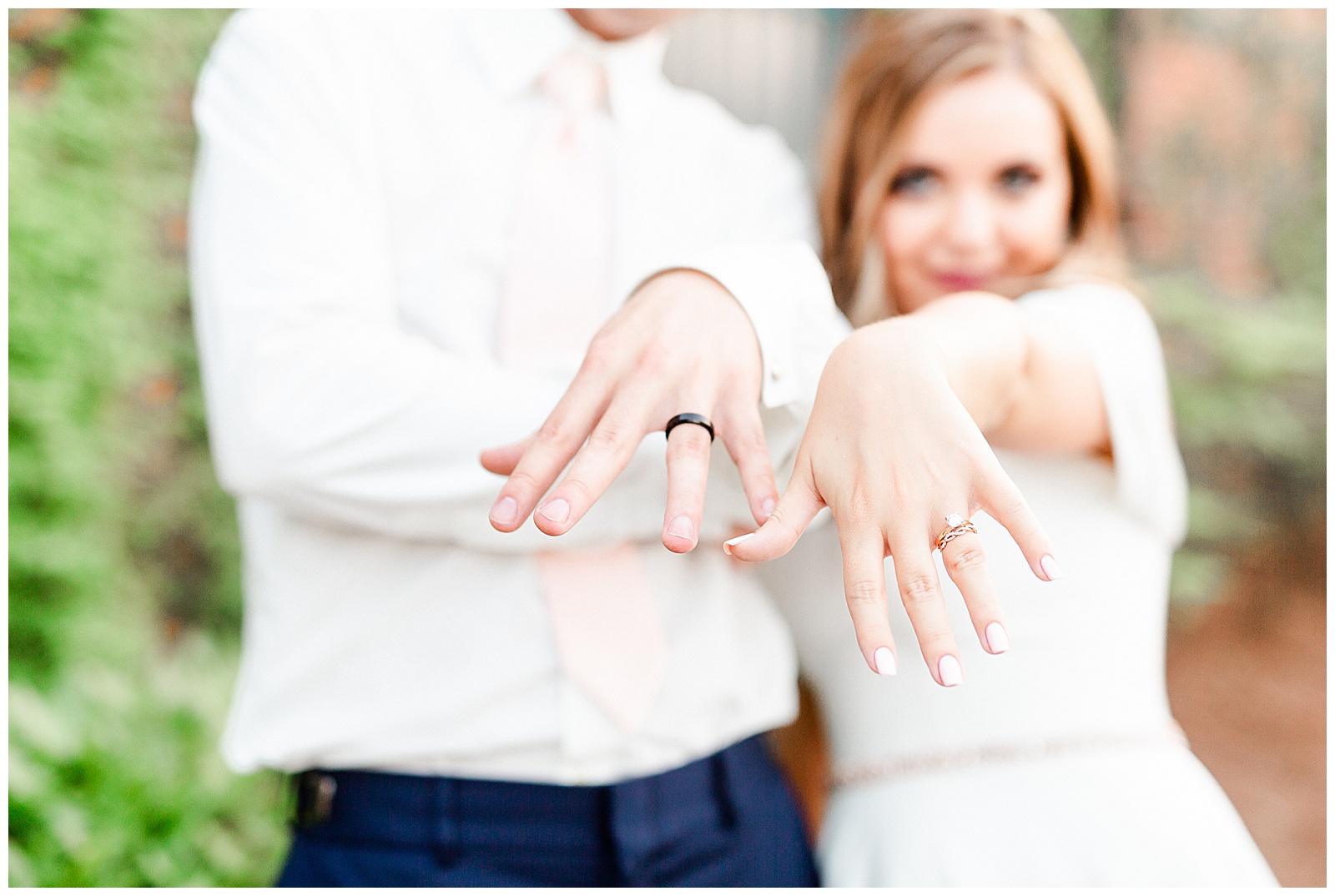 Funny Bride and Groom Photo of Rings outdoor portraits in front of vine-covered brick building from Summer Wedding in Charlotte, NC | Check out the full wedding at KevynDixonPhoto.com