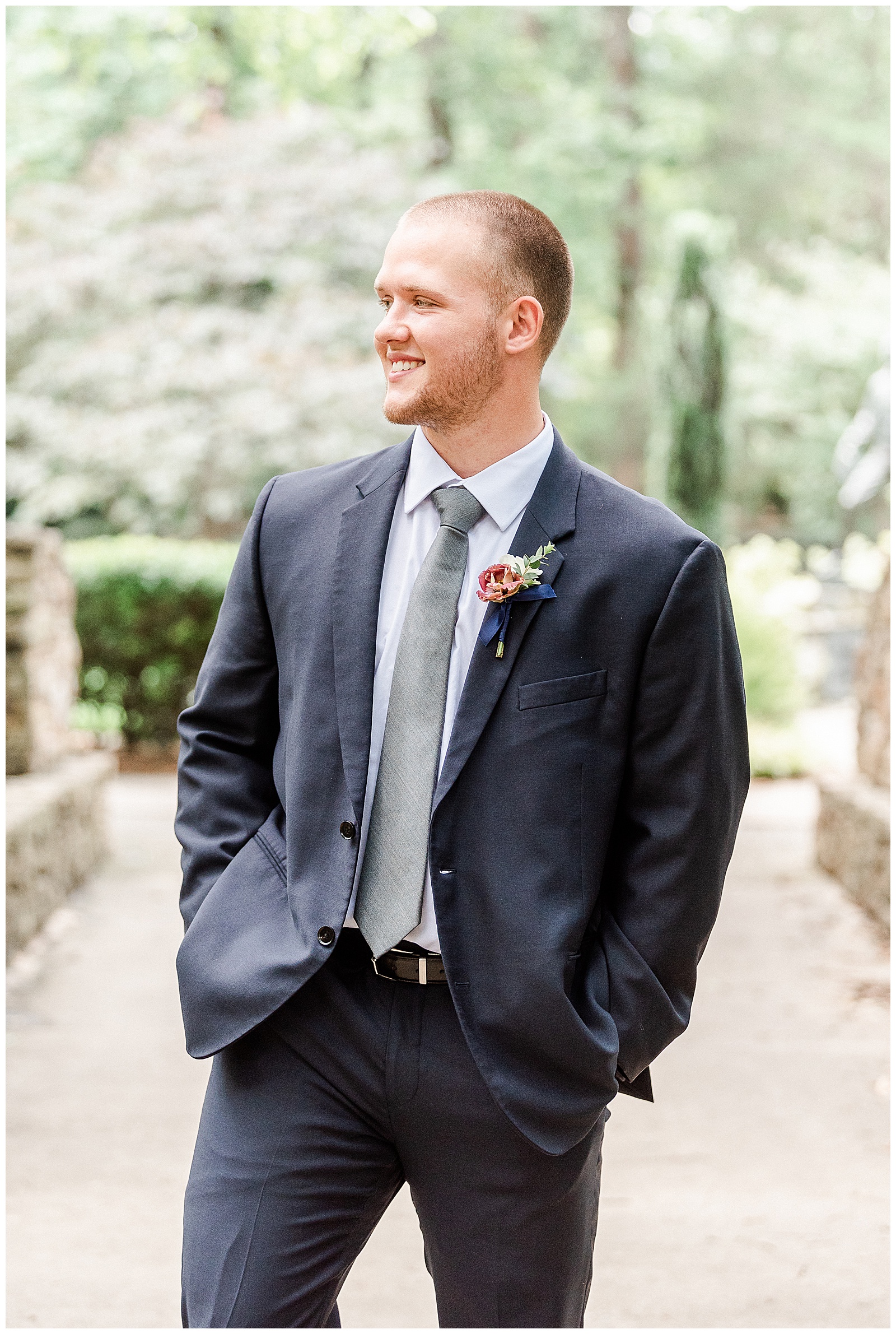 Dapper groom in dark blue-gray suits from Elegant Modern Red and Navy Blue Themed Wedding in Charlotte, NC | check out the full wedding at KevynDixonPhoto.com