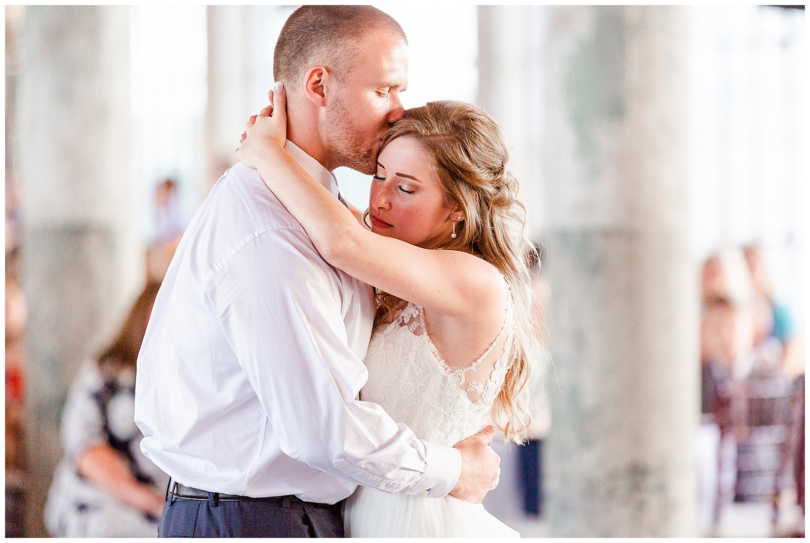 Bride and Groom Emotional First Dance at Rustic Airy Indoor Wedding Venue with fairy lights in Elegant Modern Summer Wedding in Charlotte, NC | check out the full wedding at KevynDixonPhoto.com