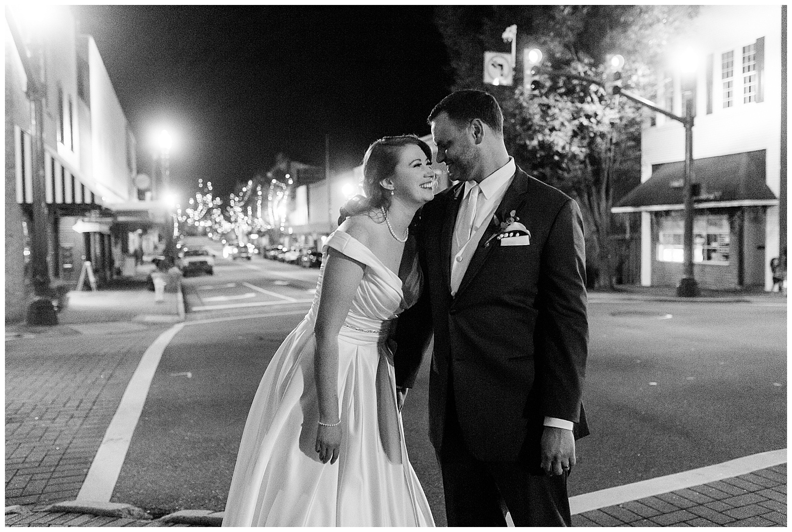 Bride and Groom share a special moment at elegant indoor floral venue in 1940s Modern Vintage Wedding in Charlotte, NC | check out the full wedding at KevynDixonPhoto.com