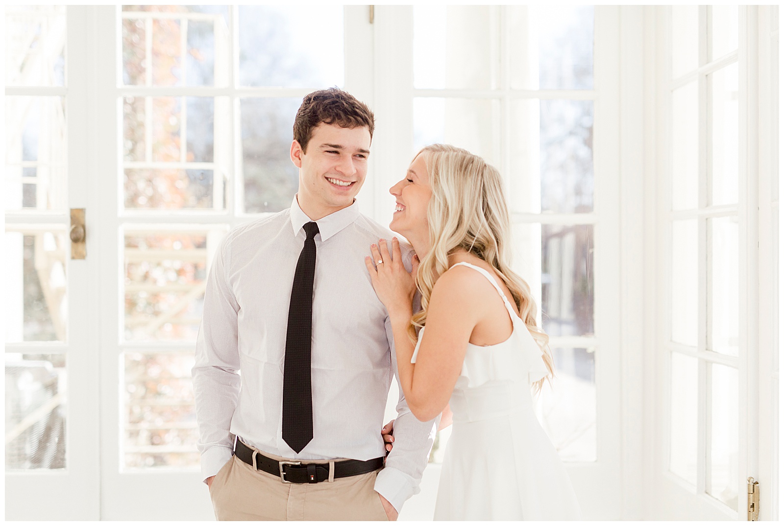 Adorable Couple Posing in Gorgeous Light and Airy Separk Mansion Engagement Session - classy black and white dress outfit ideas