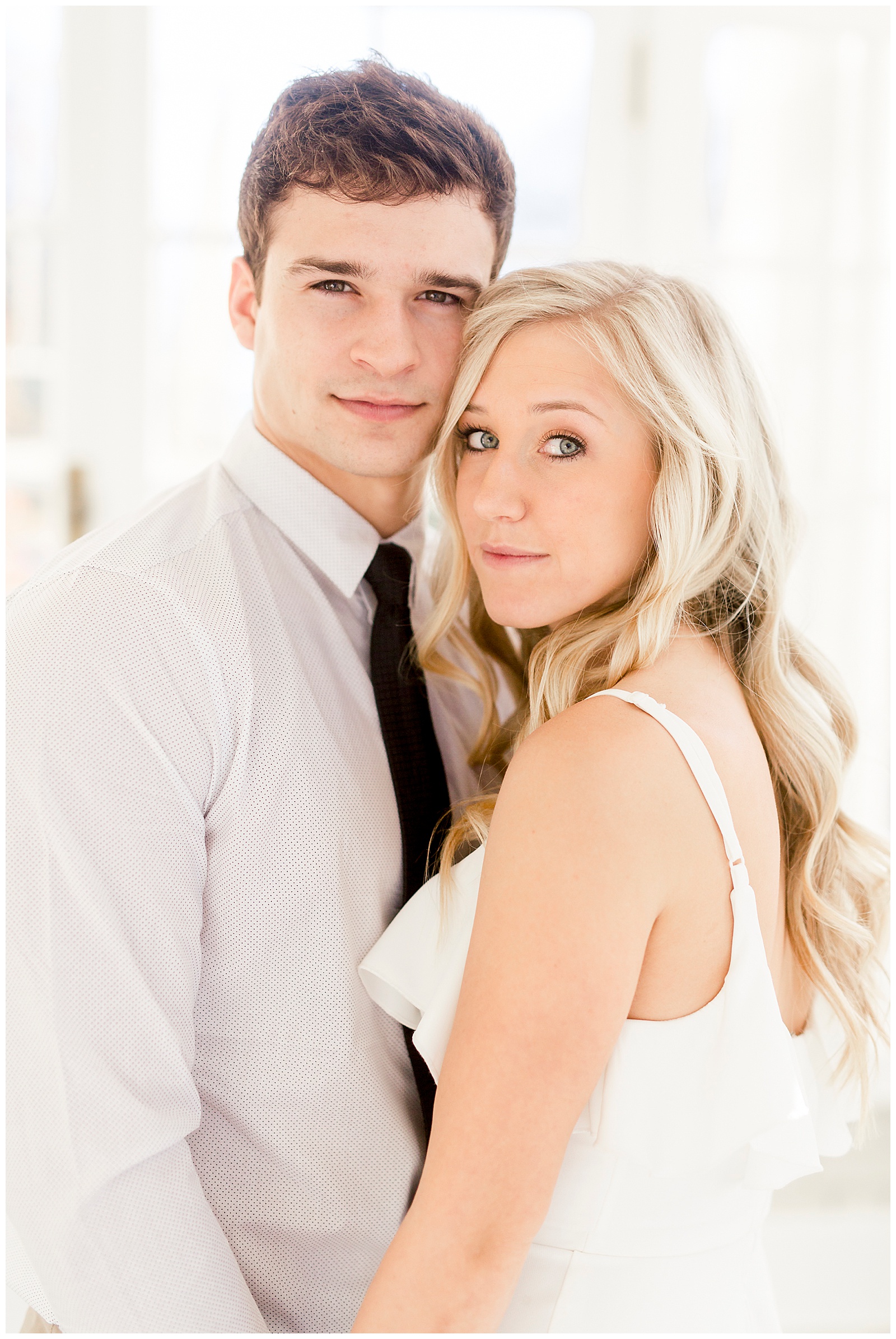Adorable Couple Posing in Gorgeous Light and Airy Separk Mansion Engagement Session - classy black and white dress outfit ideas