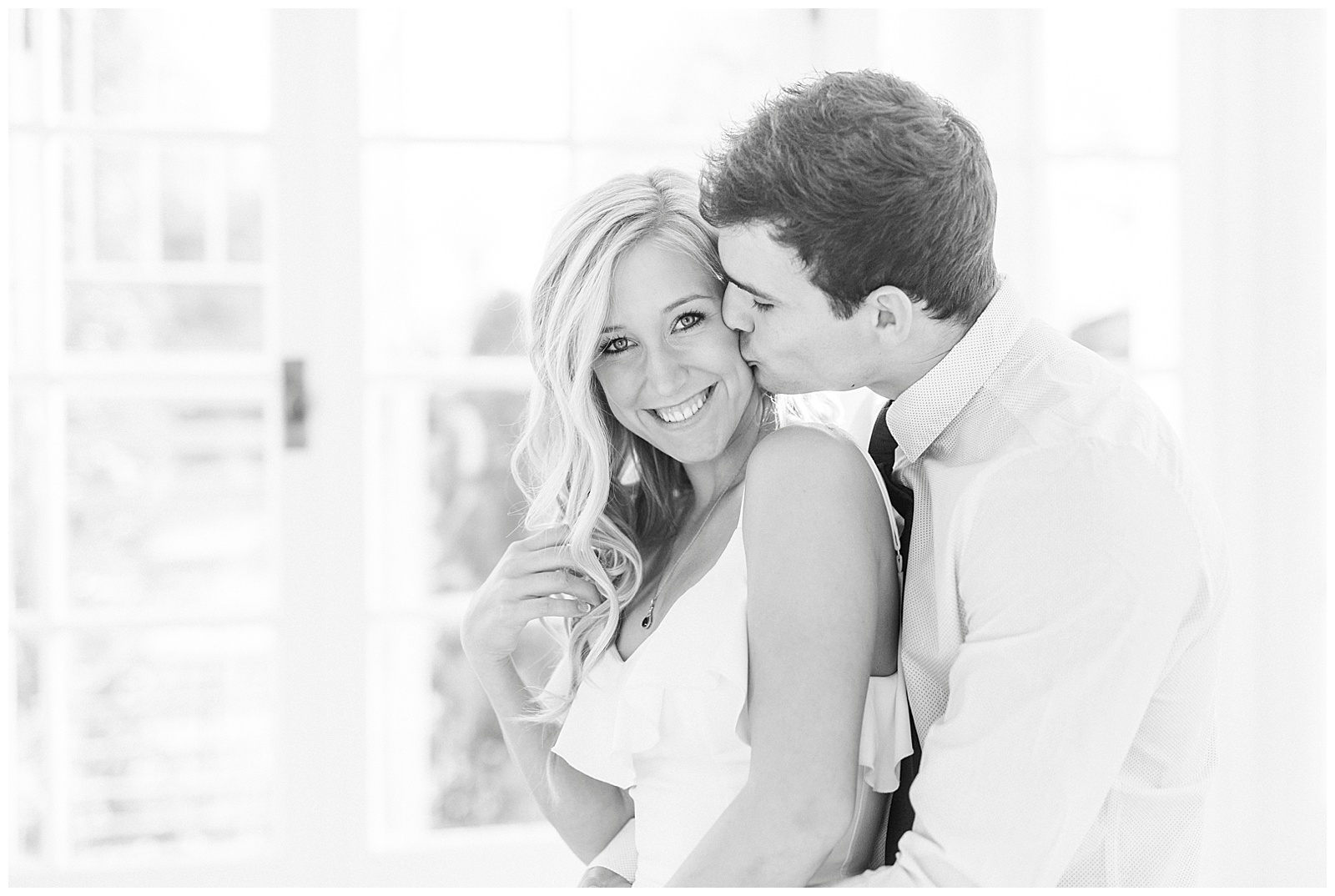 Adorable Couple Posing in Gorgeous Light and Airy Separk Mansion Engagement Session - classy black and white dress outfit ideas