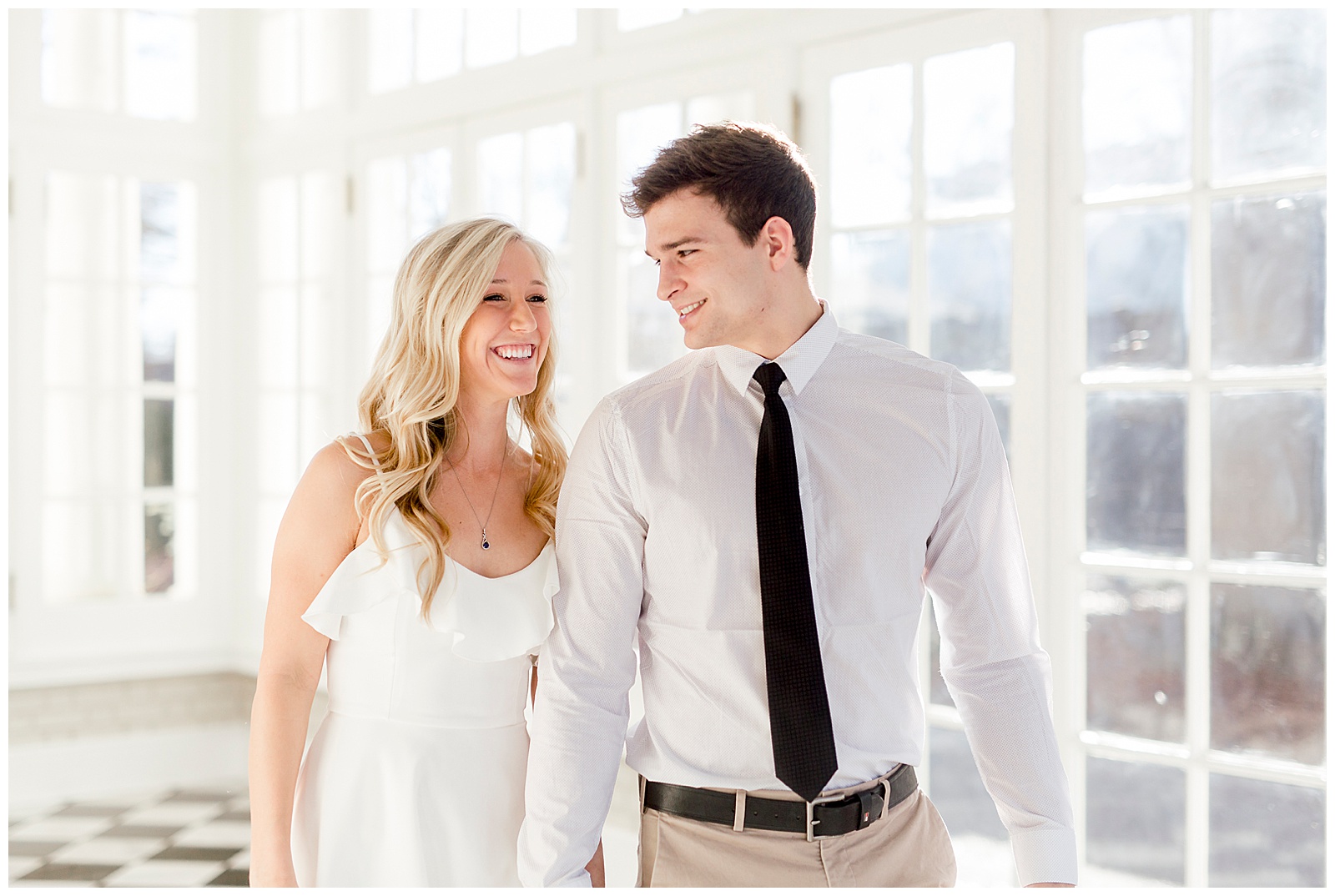 Adorable Couple Posing in Gorgeous Light and Airy Separk Mansion Engagement Session - classy black and white dress outfit ideas