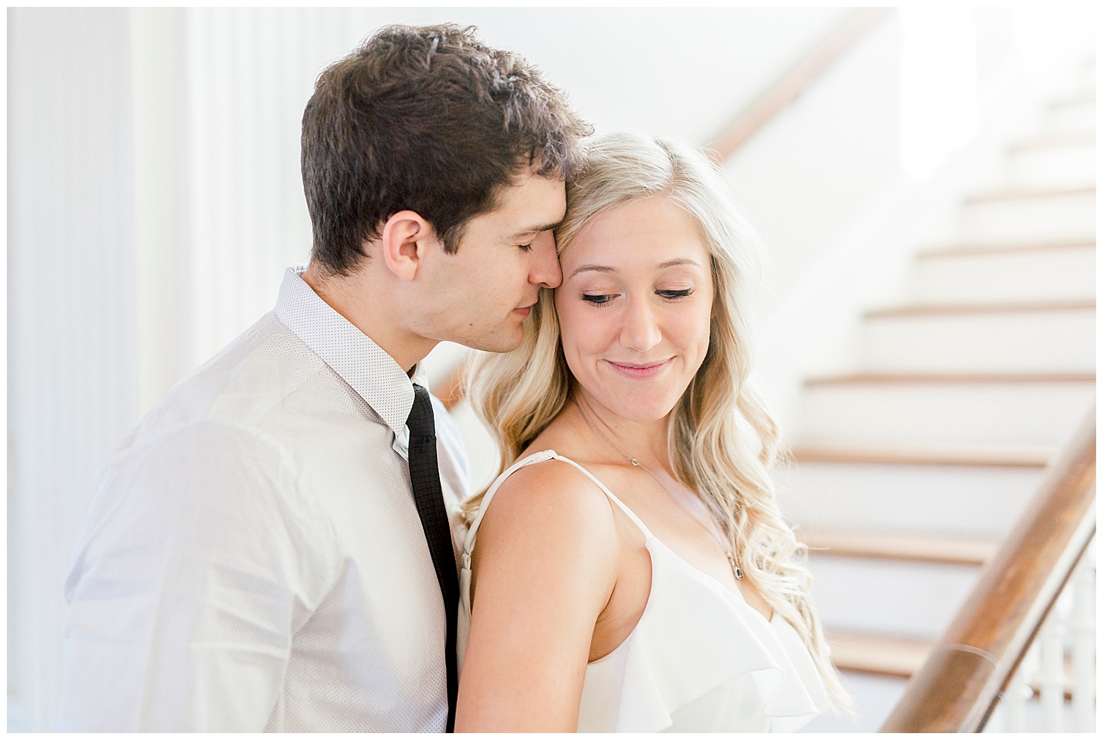 Adorable Couple Posing in Gorgeous Light and Airy Separk Mansion Engagement Session - classy black and white dress outfit ideas