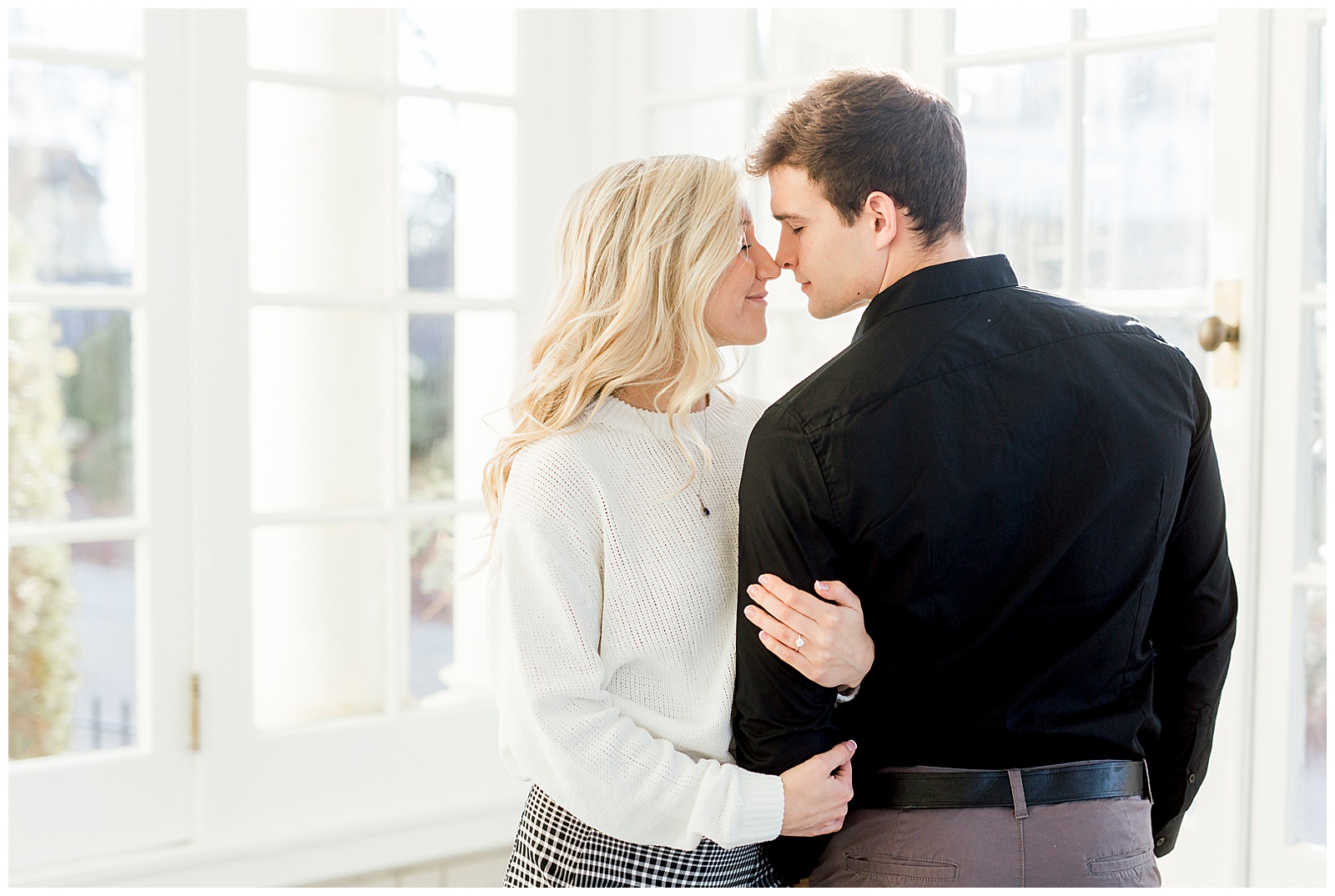 Adorable Couple Posing in Gorgeous Light and Airy Separk Mansion Engagement Session - classy cute white sweater pencil skirt and tall black boots outfit ideas