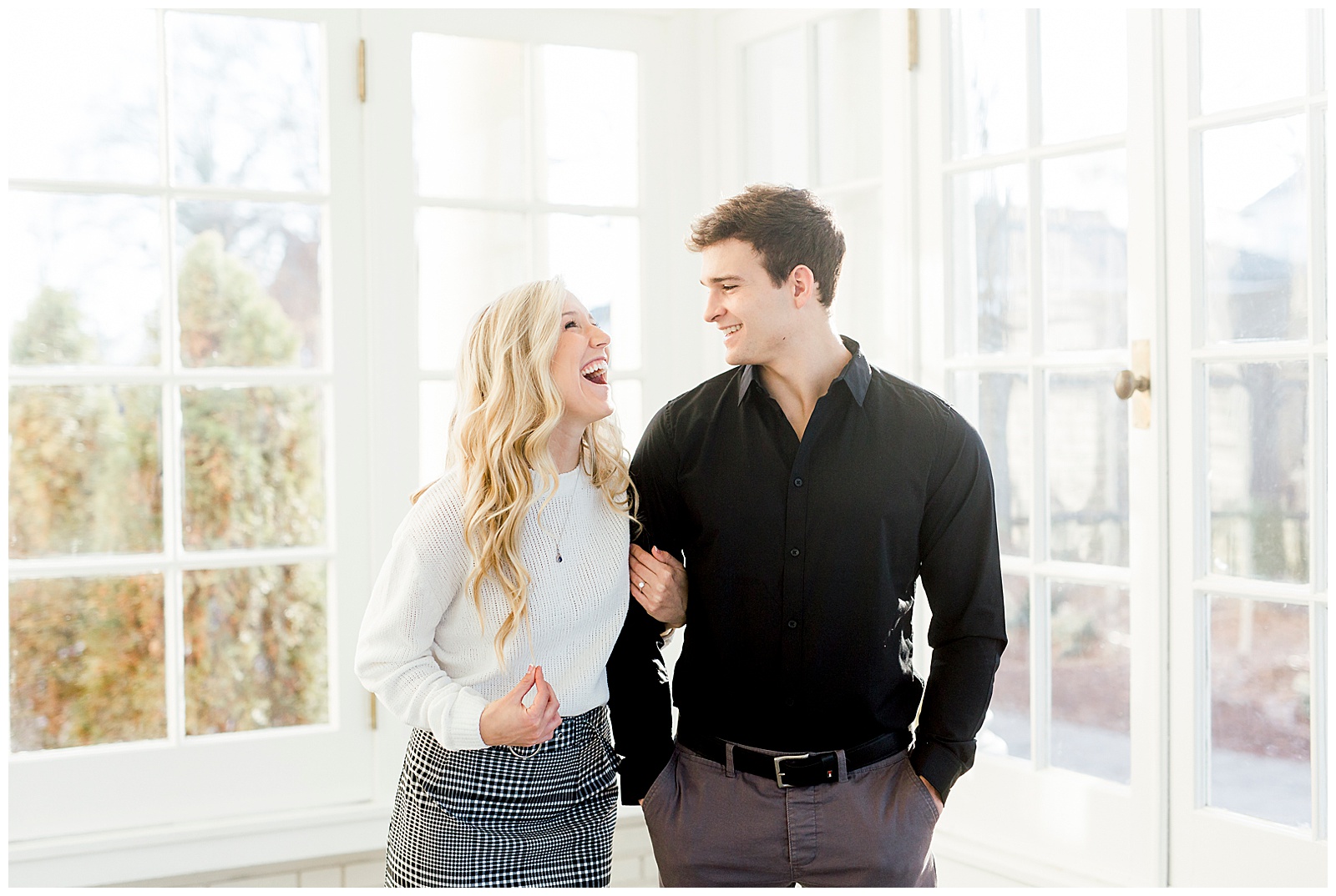 Adorable Couple Posing in Gorgeous Light and Airy Separk Mansion Engagement Session - classy cute white sweater pencil skirt and tall black boots outfit ideas