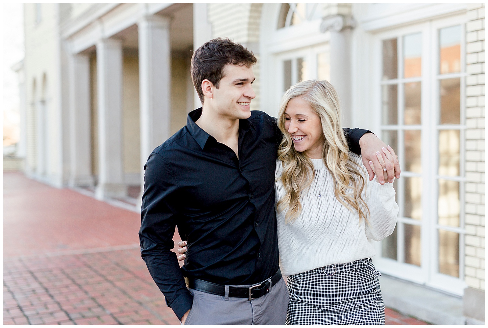 Adorable Couple Posing Outdoors in Gorgeous Light and Airy Separk Mansion Winter Engagement Session - classy cute white sweater pencil skirt and tall black boots outfit ideas
