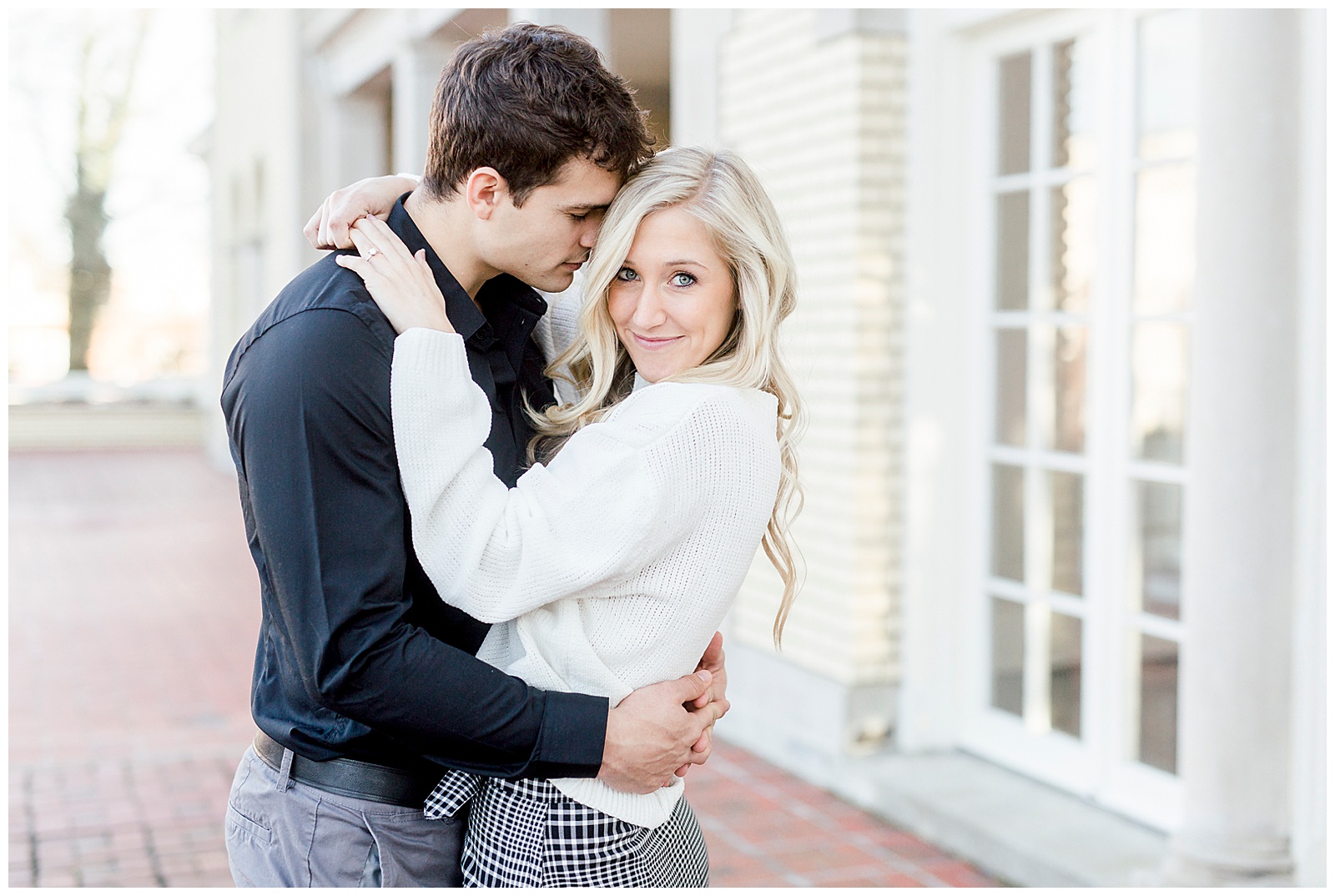 Adorable Couple Posing Outdoors in Gorgeous Light and Airy Separk Mansion Winter Engagement Session - classy cute white sweater pencil skirt and tall black boots outfit ideas