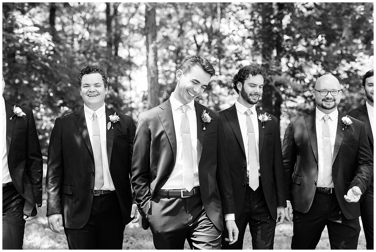 navy blue suits for groomsmen group photos laughing outdoors