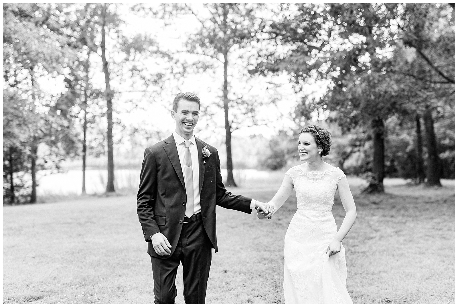 outside bride groom wedding day portraits curly short haired bride with lace wedding dress and navy blue suit groom