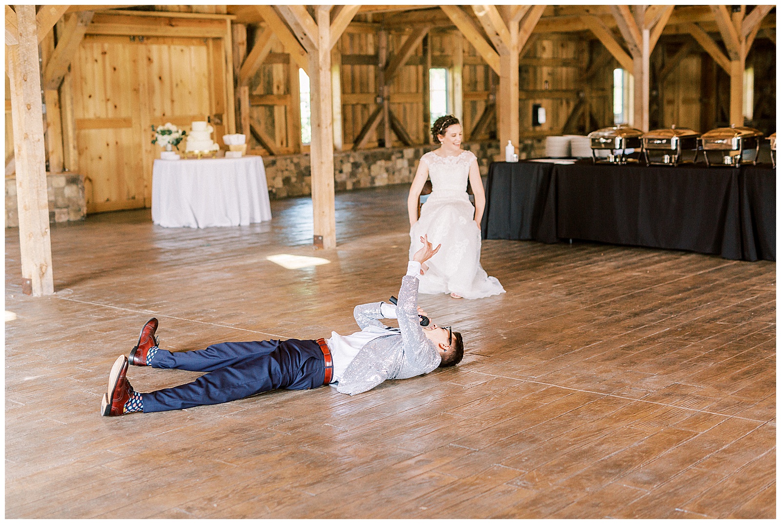 groom performs hilarious surprise song for bride in wooden open barn wedding venue
